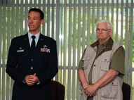Thomas Perry (right), retired from the 786th Force Support Squadron after 48 years of service, stands during his retirement ceremony at the Lindberg Hof Dining Facility, Kapaun Air Station, June 30, 2017. Perry proved his strength and support by serving service members throughout missions such as Operation Desert Shield and Operation Desert Storm, providing meals to those in need. (U.S. Air Force photo by Airman 1st Class Savannah L. Waters)
