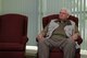 Thomas Perry, retired from the 786th Force Support Squadron after 48 years of service, listens to a speaker during his retirement ceremony at the Lindberg Hof Dining Facility, Kapaun Air Station, June 30, 2017. Perry was nominated for the U.S. Air Forces in Europe Cook of the Year award at the Castle Garden Dining Facility in 1984.  He won the award the next year, and considers it one of his greatest achievements. (U.S. Air Force photo by Airman 1st Class Savannah L. Waters)