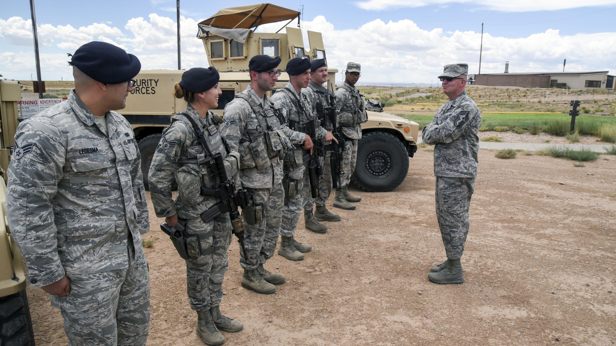 Chief Master Sgt. Thomas F. Good, Twentieth Air Force Command Chief, speaks with defenders from the 377th Weapons Systems Security Squadron at Kirtland Air Force Base, July 18. Good asked each defender why they chose to serve in the Air Force, and what made them want to be in security forces. (U.S. Air Force Photo/Senior Airman Chandler Baker)