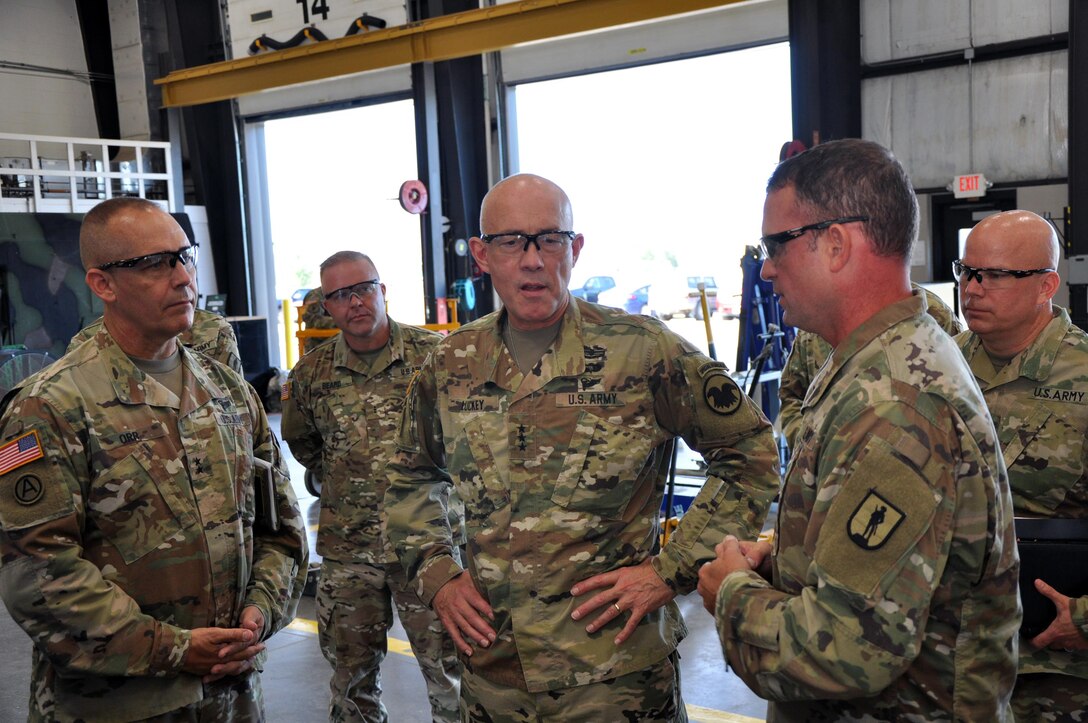 LTG Charles D. Luckey, Chief of Army Reserve and Commanding General, United States Army Reserve Command, and Maj. Gen. Timothy Orr, Adjutant General of the Iowa National Guard, listen to CW3 Dustin Hunter, Engineer Equipment Supervisor, explain some of the advancements made in automotive testing equipment Soldiers train on at the Sustainment Training Center at Camp Dodge Joint Maneuver Training Center in Johnston, Iowa on July 19, 2017.   (U.S. Air National Guard photo by Tech. Sgt. Michael McGhee/Released)