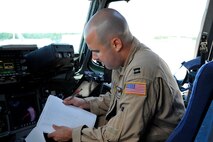 U.S. Air Force Capt. Matthew Cullen, 105th Airlift Wing C-17 Globemaster III mobility pilot, conducts a pre-flight checklist before take-off during a patient move on Ramstein Air Base, Germany, July 13, 2017. 105th AW Airmen stationed at Stewart Air National Guard Base, New York, were part of the flight crew who transported the injured service members back to the United States. (U.S. Air Force photo by Airman 1st Class D. Blake Browning)