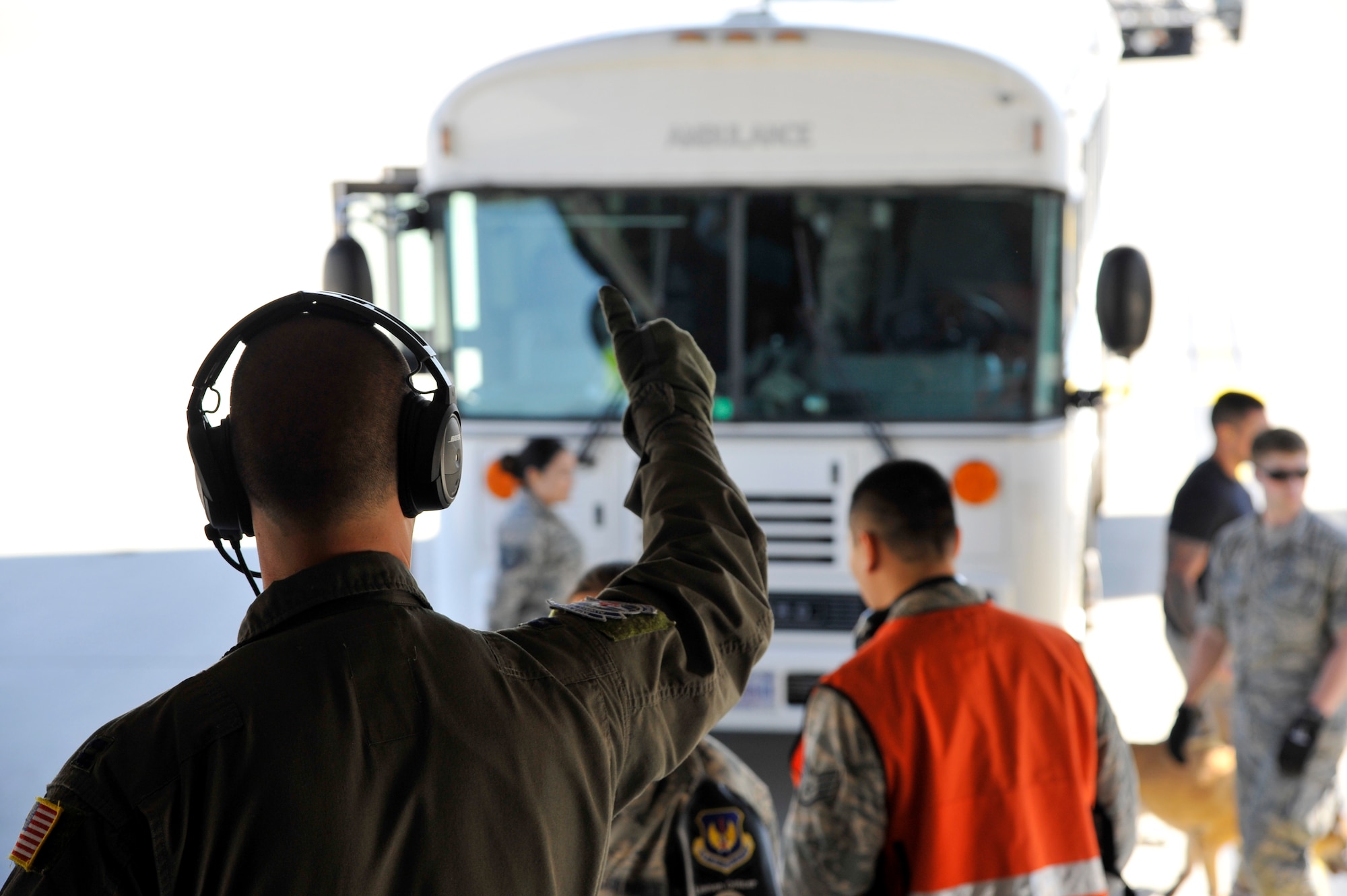 U.S. Air Force Capt. Mathew Beeman, 86th Aeromedical Evacuation Squadron standards and evaluation officer in charge, signals the start of the patient move on Ramstein Air Base, Germany, July 13, 2017. Serving United States European Command, United States Central Command, and United States Africa Command patients, the En-Route Patient Staging Facility personnel perform approximately two to 10 patient moves weekly. (U.S. Air Force photo by Airman 1st Class D. Blake Browning)