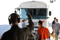 U.S. Air Force Capt. Mathew Beeman, 86th Aeromedical Evacuation Squadron standards and evaluation officer in charge, signals the start of the patient move on Ramstein Air Base, Germany, July 13, 2017. Serving United States European Command, United States Central Command, and United States Africa Command patients, the En-Route Patient Staging Facility personnel perform approximately two to 10 patient moves weekly. (U.S. Air Force photo by Airman 1st Class D. Blake Browning)