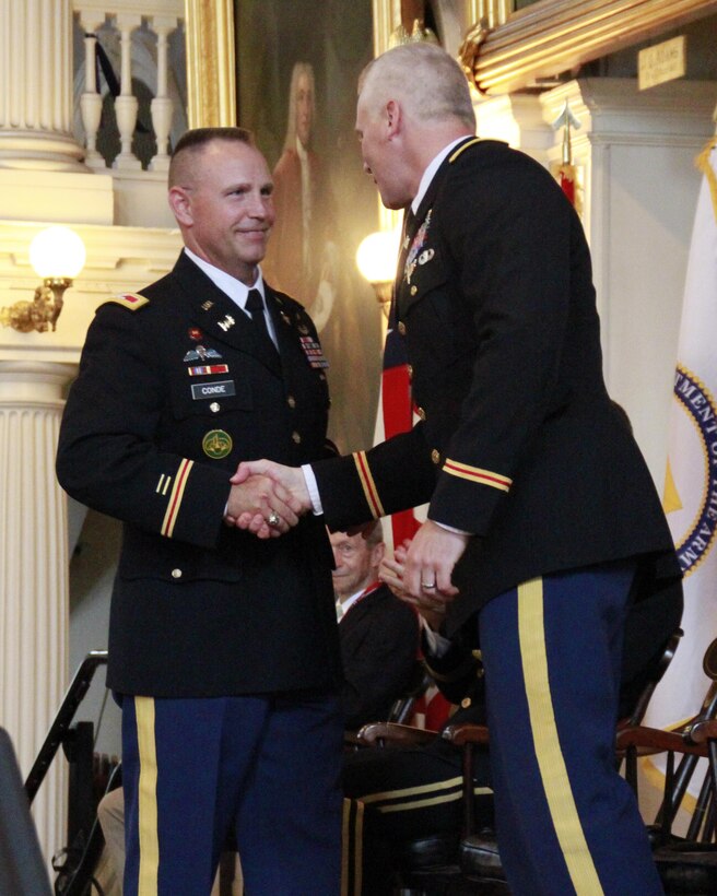 U.S. Army Col. Christopher Barron, congratulates Col. William M. Conde as the new district engineer and commander of the U.S. Army Corps of Engineers, New England District.  Barron relinquished command during a formal change of command ceremony July 19, 2017 at the historic Faneuil Hall in Boston, Mass. (U.S. Army photo by Diallo Ferguson/Released)