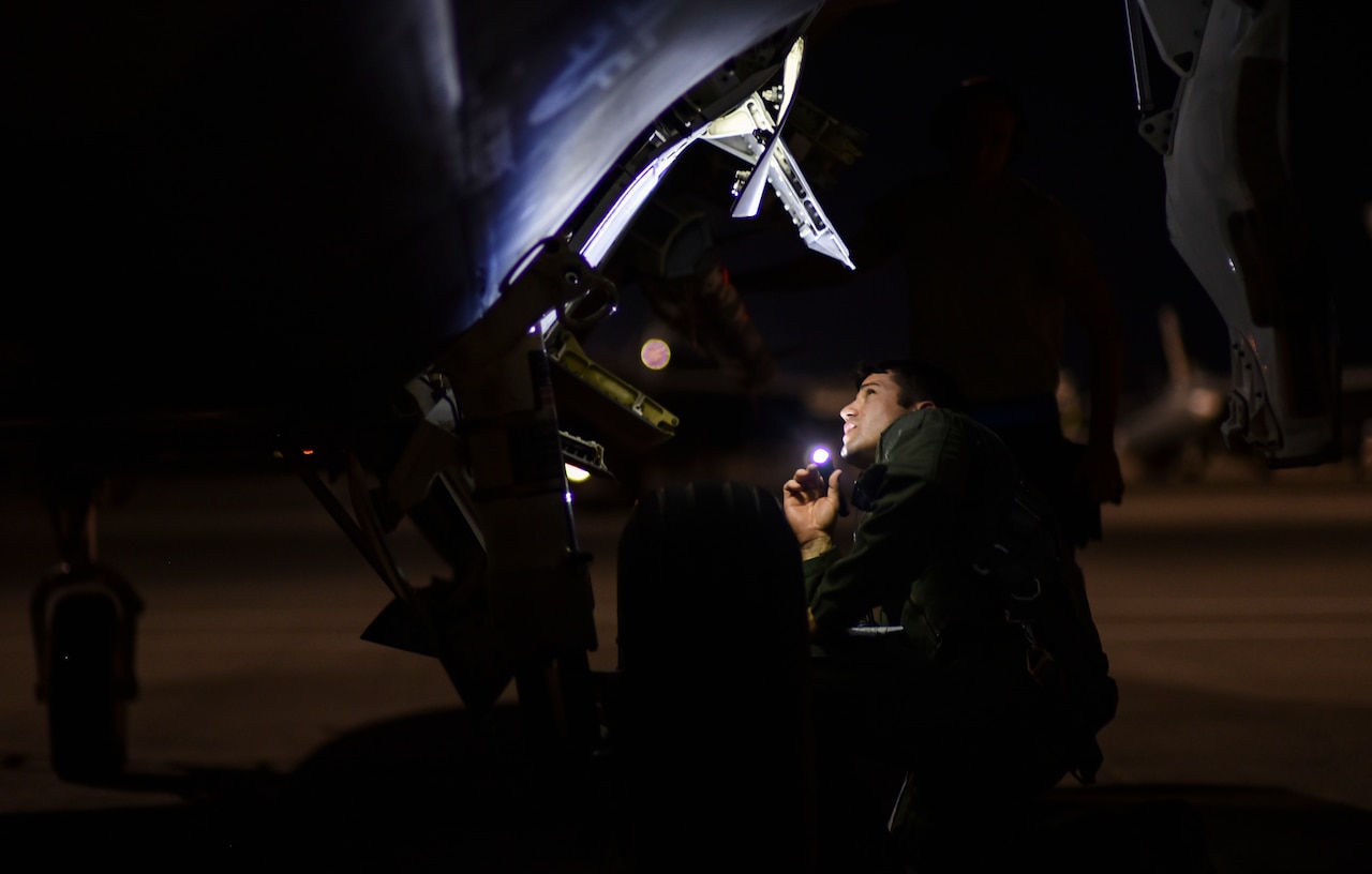 Air Force Maj. Ryan Nickell, a pilot assigned to the 95th Fighter Squadron, Tyndall Air Force Base, Fla., performs a preflight check on an F-22 Raptor at exercise Red Flag 17-3 at Nellis Air Force Base, Nev., July 10, 2017. Air Force photo by Senior Airman Dustin Mullen