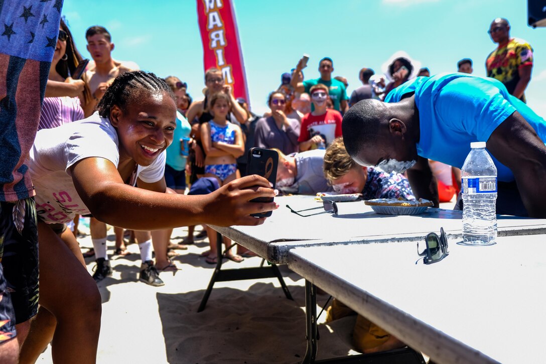 Commanders take a seat at the head table and represent their companies in the annual Beach Bash pie eating contest.  This year, Captain Joe Zukowski, Commander of Alpha Company, narrowly conquered last years champion Major Andrew Law, Commander of Service Company.