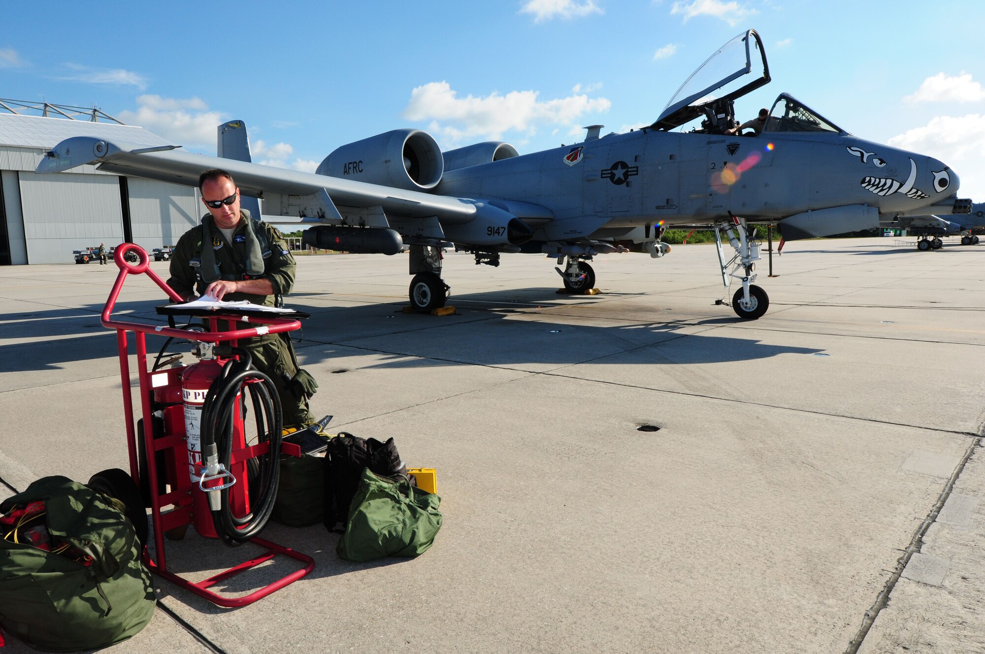 U.S. Air Force Lt. Col. Brandon Kelly, 47th Fighter Squadron pilot, conducts a pre-flight inspection on a A-10 Thunderbolt II on the flightline at Naval Air Station Key West, Florida during the 924th Fighter Group’s annual training, July 17. The pilots took this opportunity to teach eight student pilots how to fly in and out of new airspace and firing at a new target range. (U.S. Air Force photo by Technical Sgt. Courtney Richardson)