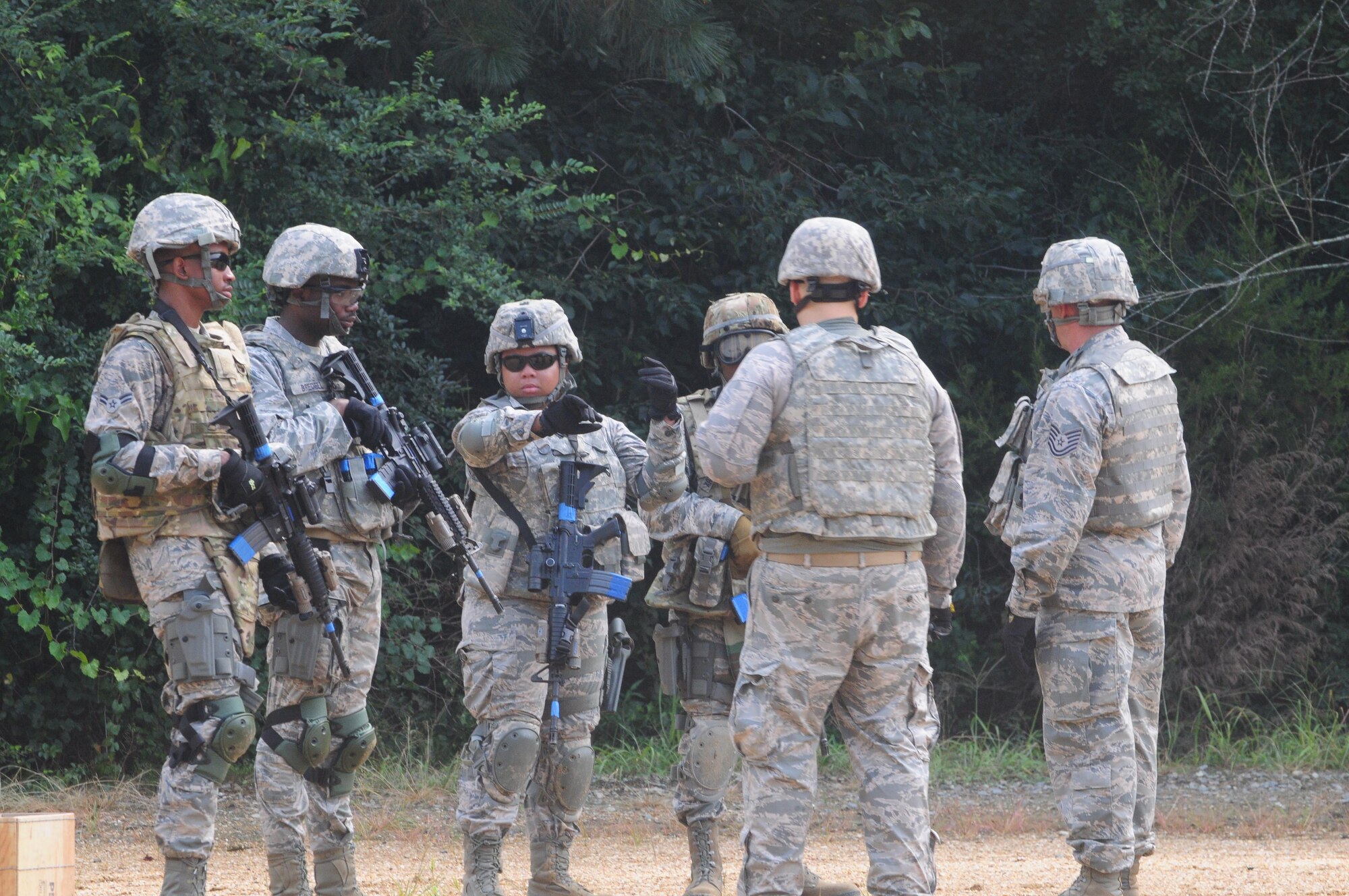 Members of the 916th Security Forces Squadron prepare to enter the “shoot, move and communicate” training area on July 16, 2017, at Seymour Johnson Air Force Base, North Carolina. (U.S. Air Force photo by Senior Airman Jeramy Moore)