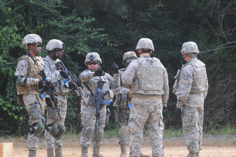 Members of the 916th Security Forces Squadron prepare to enter the “shoot, move and communicate” training area on July 16, 2017, at Seymour Johnson Air Force Base, North Carolina. (U.S. Air Force photo by Senior Airman Jeramy Moore)