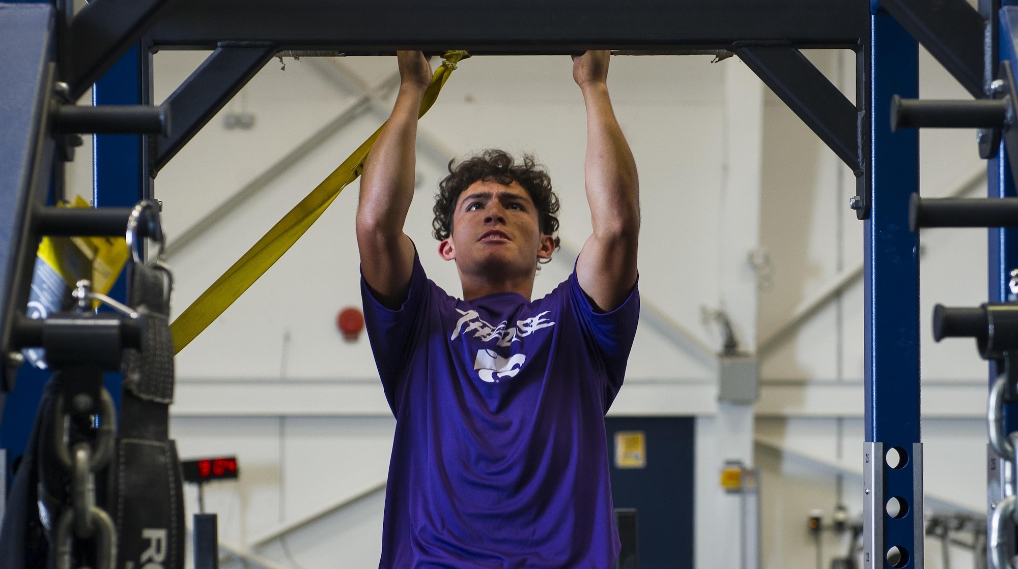 A Clovis High School football player exercises at the 26th Special Tactics Squadron’s gymnasium during his team’s tour at Cannon Air Force Base, NM, July 19, 2017. The students, currently in their pre-season form, endured the rigorous regimen that 26th STS Airmen follow to maintain mission readiness. (U.S. Air Force photo by Senior Airman Lane T. Plummer)