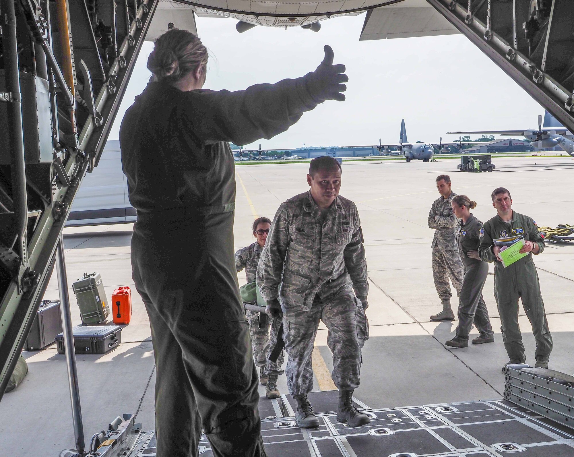 Members of the 934th Aeromedical Evacuation Squadron train aboard a 934th Airlift Wing C-130 flight July 16.  The squadron provides worldwide in-flight medical care. (Air Force Photo/Paul Zadach)