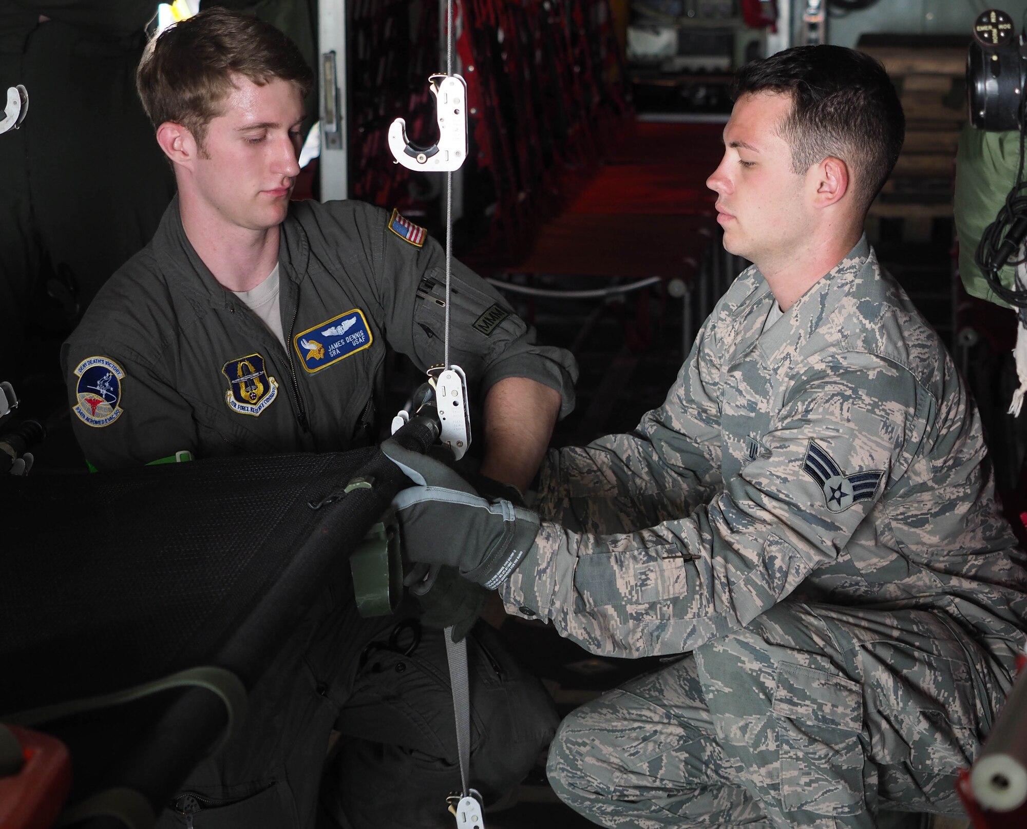 Members of the 934th Aeromedical Evacuation Squadron train aboard a 934th Airlift Wing C-130 flight July 16.  The squadron provides worldwide in-flight medical care. (Air Force Photo/Paul Zadach)