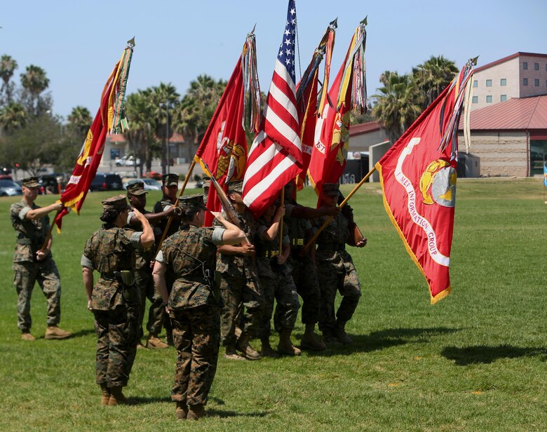 Col. Bobbi Shea (left) and Col. Dawn R. Alonso (right) salute the national and Marine Corps colors in the traditional pass and review during the change of command and re-designation ceremony at Camp Pendleton, Calif., July 6, 2017. During the ceremony I Marine Expeditionary Force Headquarters Group was re-designated as I MEF Information Group to support I MEF in the expanding information environment. (U.S. Marine Corps photo by Lance Cpl. Robert A Alejandre)