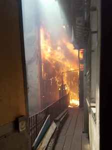 An apartment building on fire in L'viv, Ukraine, on July 16, 2017. Soldiers with the Oklahoma Army National Guard’s 45th Infantry Brigade Combat Team, deployed to Ukraine in support of the Joint Multinational Training Group-Ukraine, rushed into the burning building and evacuated the third floor before  firefighters arrived.