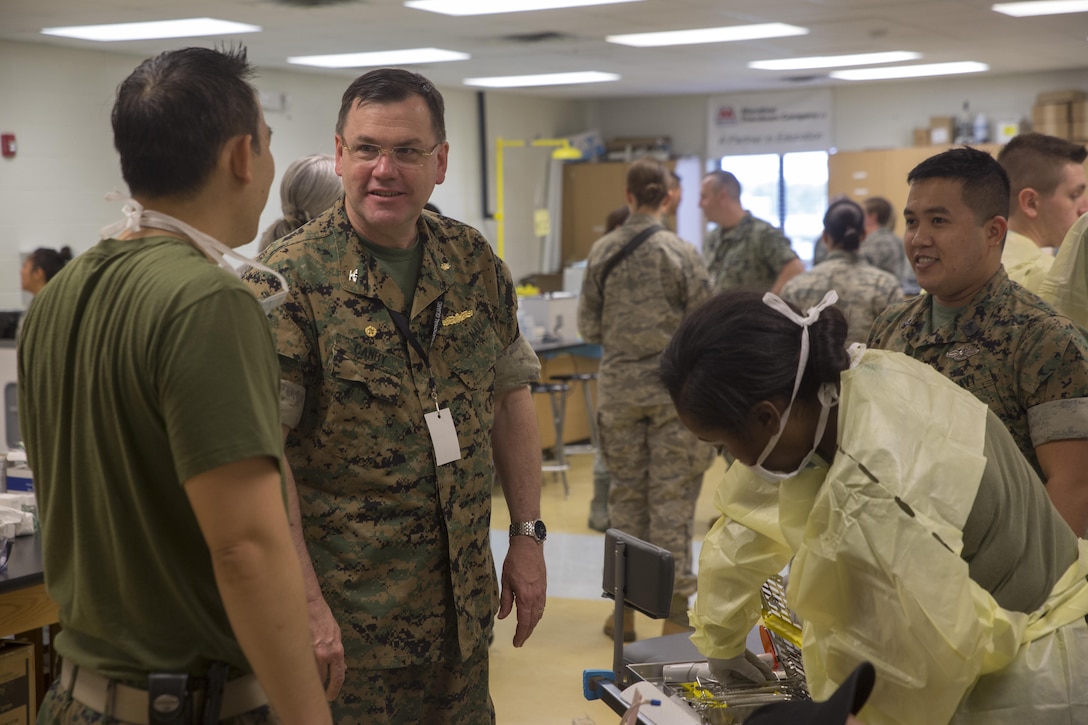 Navy Capt. Frederick Canby, commanding officer of 4th Dental Battalion, 4th Marine Logistics Group, Marine Forces Reserve, talks to corpsmen supporting Innovative Readiness Training Louisiana Care 2017 at East Saint John High School in Reserve, La., July 15, 2017. Several of the patients attending the IRT came for dental services such as fillings, simple dental extractions, screenings for oral cancer and examinations for sports medicine injuries. (U.S. Marine Corps photo by Lance Cpl. Niles Lee/Released) 