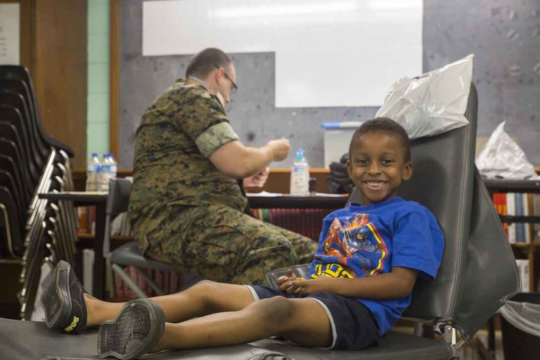 Daniel Wilson, a patient attending Innovative Readiness Training Louisiana Care 2017, smiles after getting his teeth inspected by a Navy Corpsman at Amite High School in Amite, La., July 15, 2017. Several of the patients attending the IRT came for dental services such as fillings, simple dental extractions, screenings for oral cancer and examinations for sports medicine injuries. (U.S. Marine Corps photo by Lance Cpl. Niles Lee/Released) 