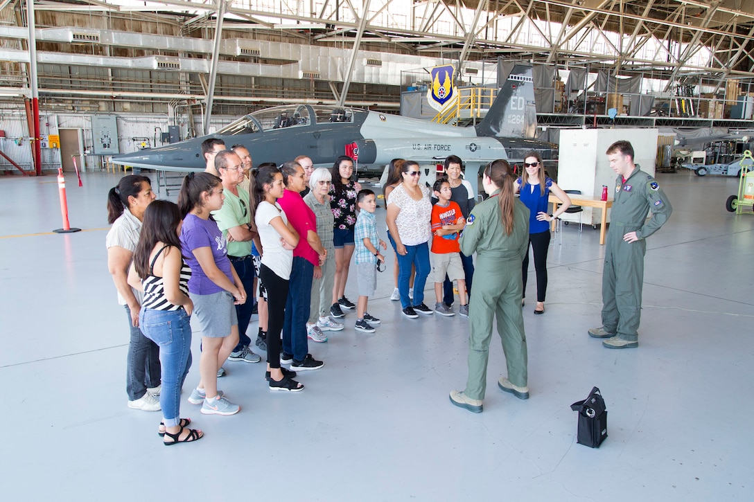 Tech Trekkers receive a plane-side briefing about flight test next to a T-38 Talon Supersonic Trainer in Hangar 1207. 
Tech Trek is a girls’ math and science camp organized by the American Association of University  Women, and is designed to instill confidence among female students as they begin to consider careers in science, technology, engineering and mathematics disciplines. (U.S. Air Force photos by Christopher Okula)

