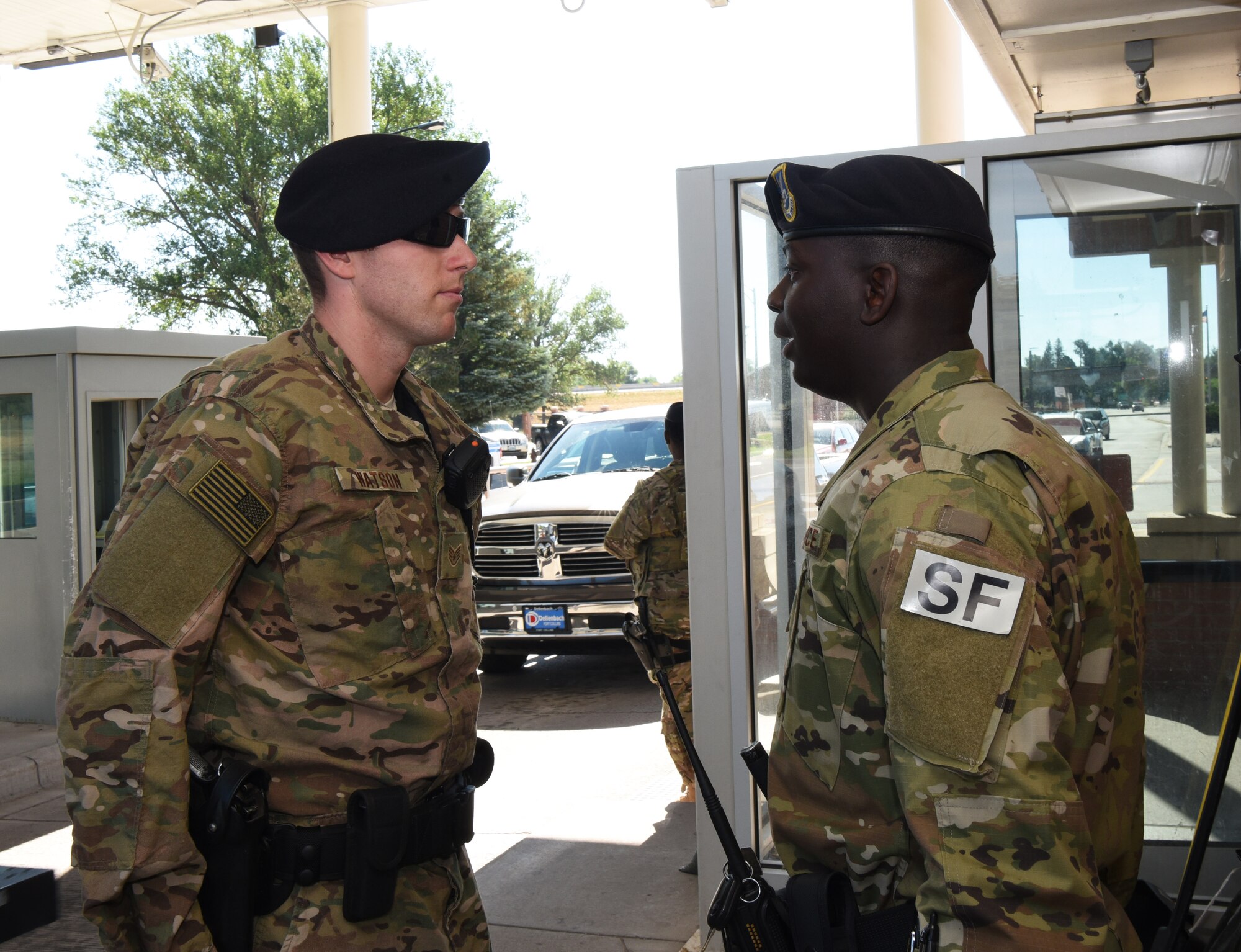 Airman 1st Class Zarquis Butler, 90th Security Forces Squadron entry controller, recites his post briefing to Staff Sgt. Charles Watson, 90th SFS patrolman, at F.E. Warren Air Force Base, Wyo., July 14, 2017. This is a briefing to inform the inspecting individual about the assigned duties and a description of what the defender is armed with and the weapon's capabilities. (U.S. Air Force photo by Airman 1st Class Breanna Carter)