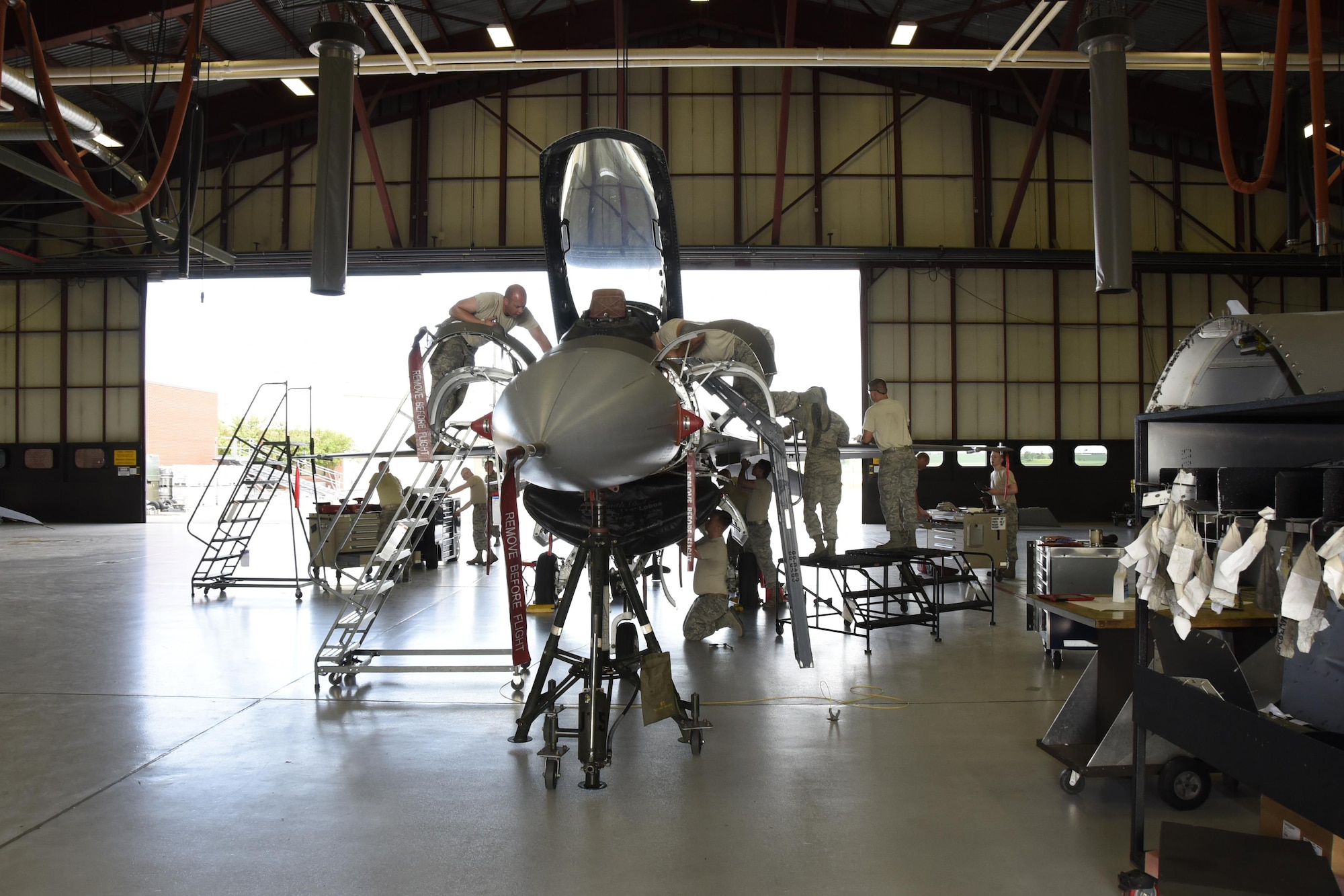 Airmen of 114th Aircraft Maintenance Squadron phase inspection element removed paneled from an F-16 during the De-paneling Phase of a phase maintenance inspection at Joe Foss Field, July 8, 2017.  Each aircraft is required to go through a phase inspection every 400 flight hours to ensure all systems are functioning with in Air Force regulations.  (U.S. Air National Guard photo by Master Sgt. Christopher Stewart/Released)