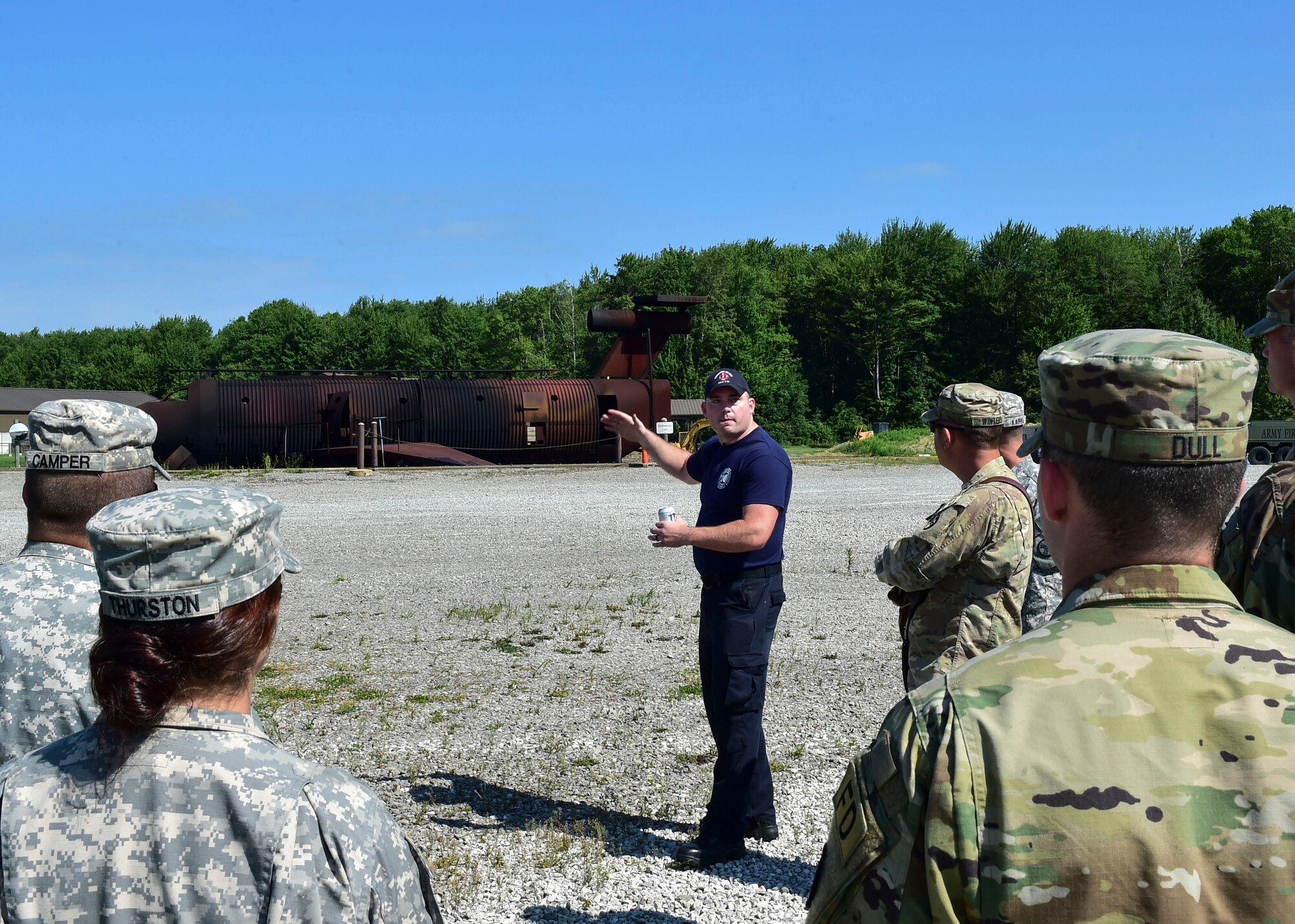 Cody Anderson, a firefighter for the 910th Fire Department, welcomes Soldiers of the 5694th Engineer Detachment from the Army National Guard stationed in Mansfield, Ohio, July 18, 2017, here. The burn pit provides real time firefighting training experiences for not only YARS but for its neighbors too. (U.S. Air Force Photo/Senior Airman Jeffrey Grossi)