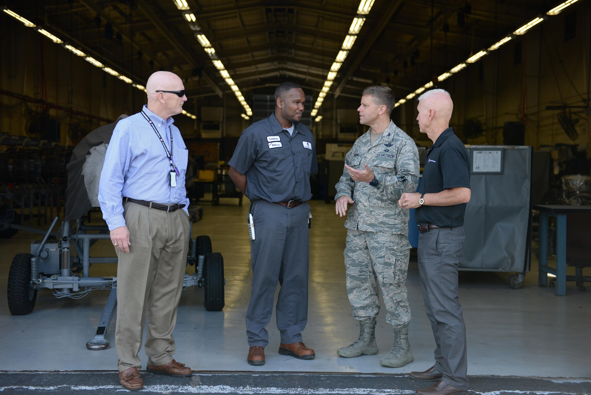 Col. William Denham, 14th Flying Training Wing Vice Commander, speaks with the L3 contracted maintainers July 17, 2017, on Columbus Air Force Base, Mississippi. The maintainers on Columbus AFB are contracted out and are a large part of the Columbus AFB community. (U.S. Air Force photo by Airman 1st Class Keith Holcomb) 
