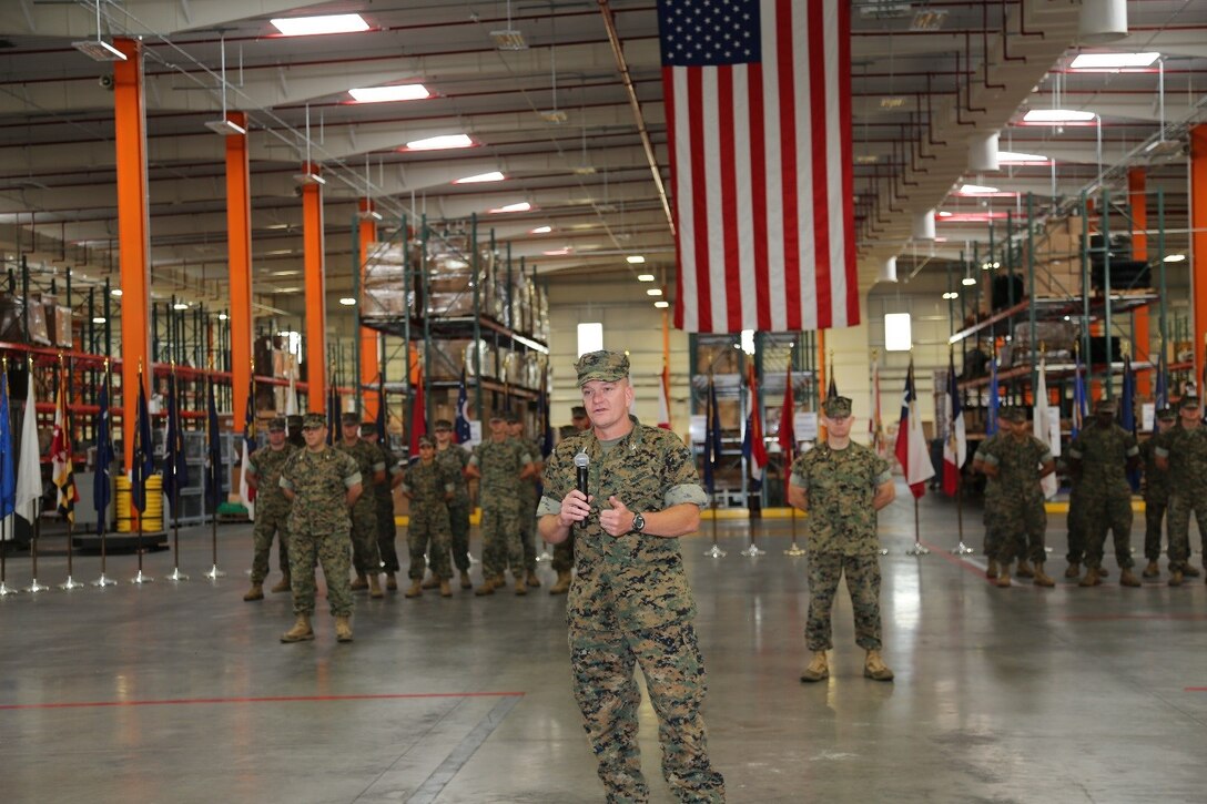 Colonel Andrew J. Bergen, incoming Commander, addresses the crowd after accepting the flag from Colonel Brian G. Hughes, outgoing commander during a Change of Command Ceremony held on 14 July, 2017 at Blount Island Command in Jacksonville, FL.
