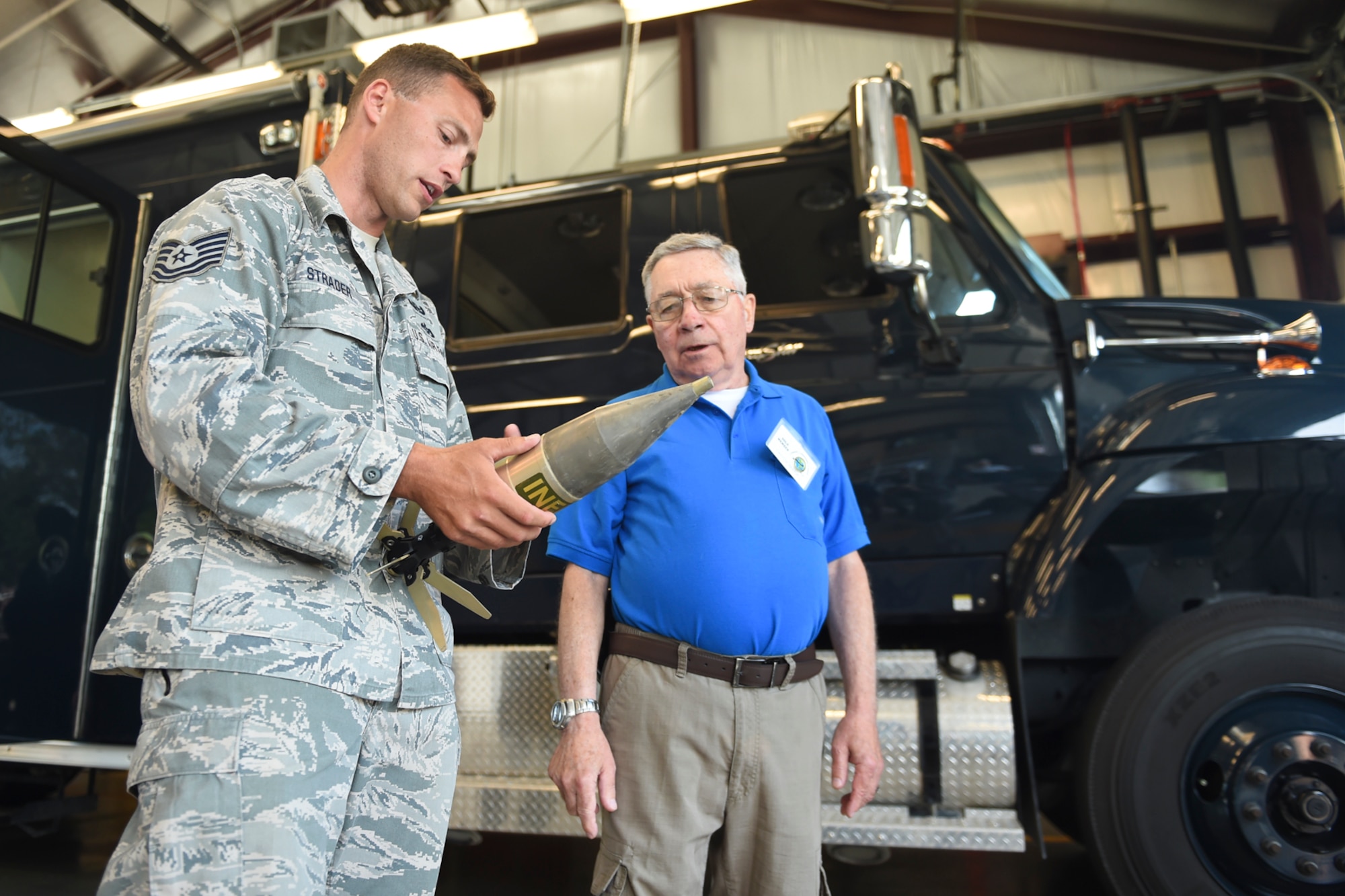 Tech. Sgt. Timothy Strader, 434th Civil Engineer Squadron equipment non-commissioned officer in charge, explains different types of explosives to Grover Bishop, Grissom Community Council member, at Grissom Air Reserve Base, Ind., July 7, 2017. EOD members go through extensive training to be able to identify explosive ordinances. (U.S. Air Force photo/Senior Airman Cali Wetli)
