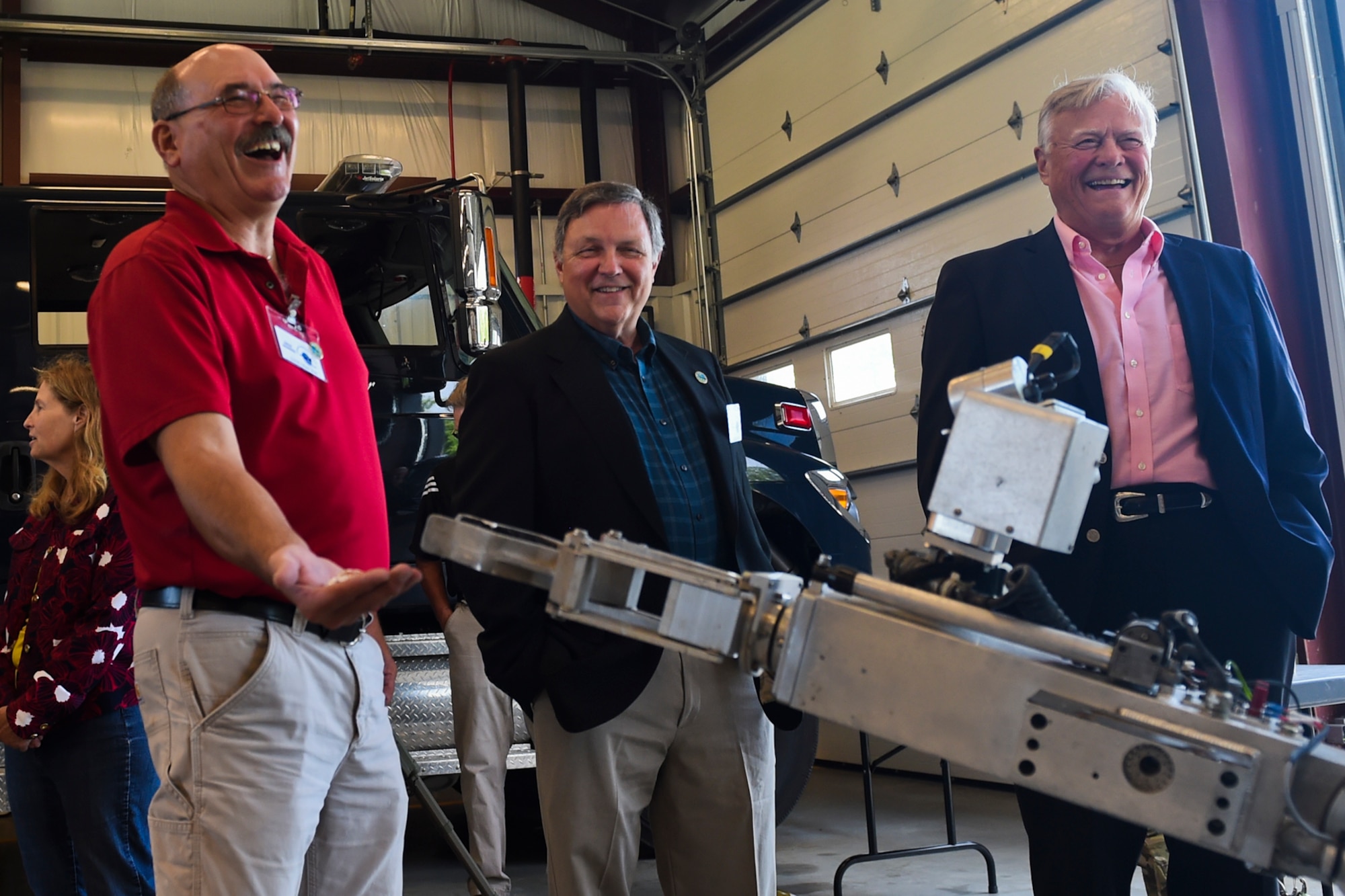 From left to right, Dane Orbaugh, Russel Dick and Tom Weatherwax, Grissom Community Council members, observe the Explosive Ordnance Disposal robot in action at Grissom Air Reserve Base, Ind., July 7, 2017. During the visit, the robot picked up a piece of bubble gum and placed it in Orbaugh’s hand. (U.S. Air Force photo/Senior Airman Cali Wetli)