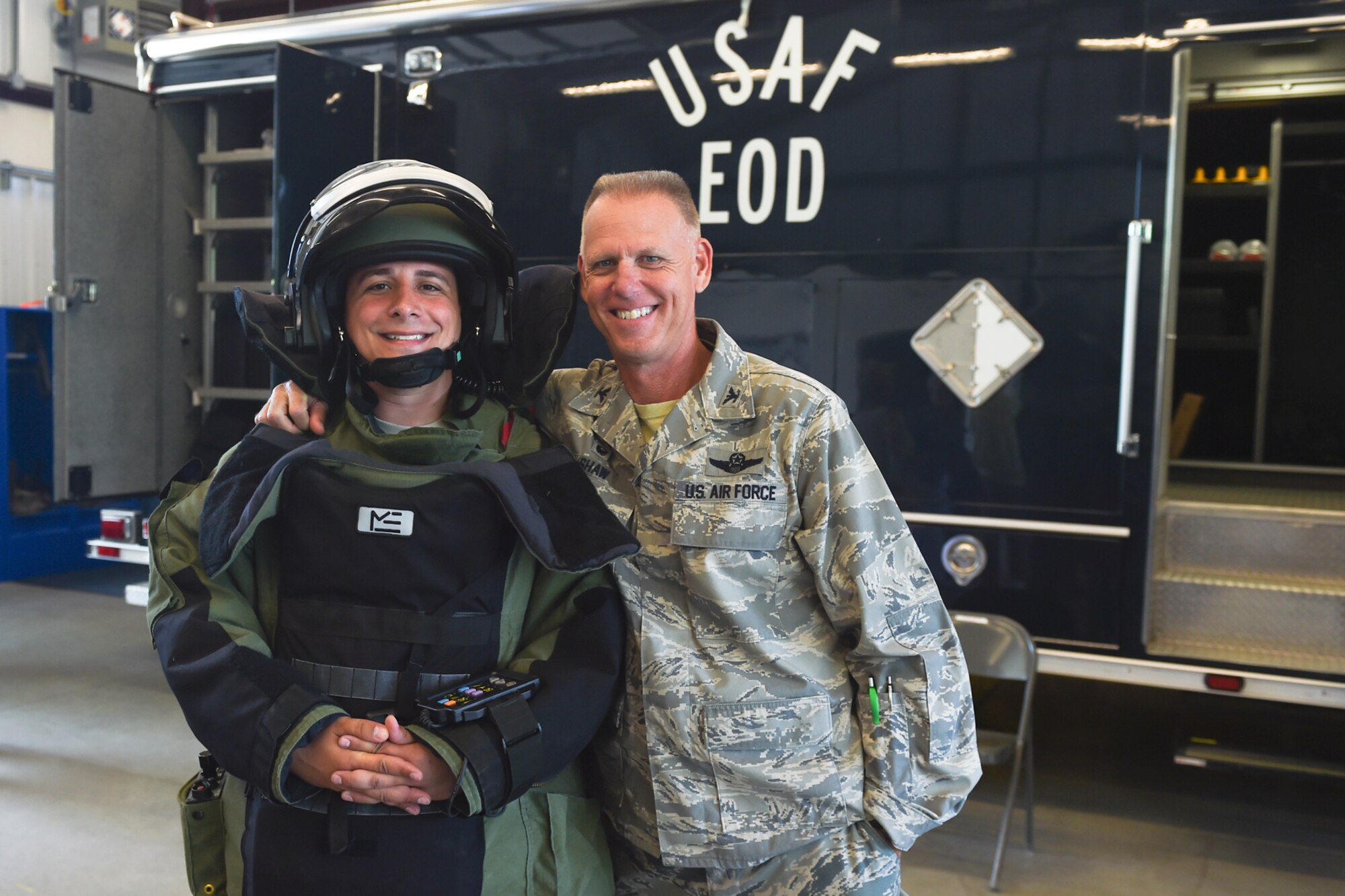 Col. Larry Shaw, 434th Air Refueling Wing Commander, poses with Senior Airman Rogerito Miravetedisantis, 434th Civil Engineer Squadron Explosive Ordinance journeyman, during a tour of the EOD building at Grissom Air Reserve Base, Ind., July 7, 2017. The tour was held for the Grissom. Community Council to get an inside look at Grissom’s mission. (U.S. Air Force photo/Senior Airman Cali Wetli)