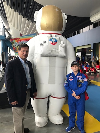 Failure is Not an Option Scholarship Fund founder Russ Dunford, left, poses for a picture with 2017 scholarship recipient Jayce Neal at Space Camp graduation.