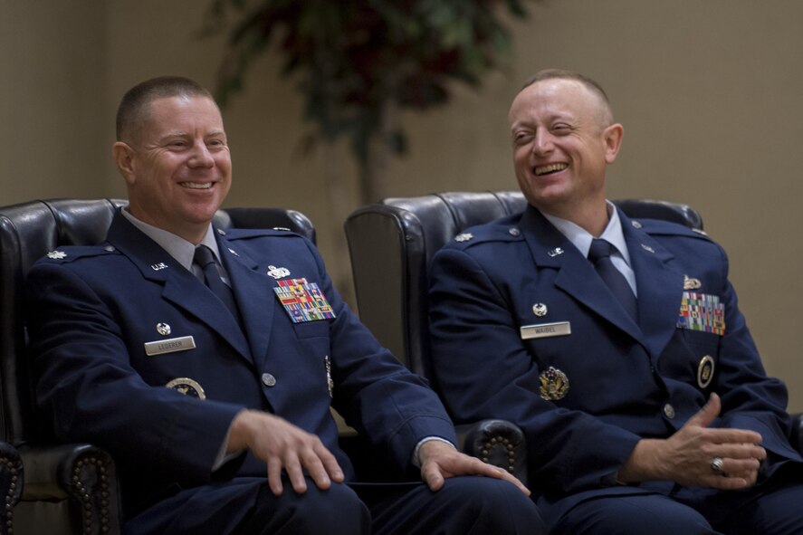 Lt. Col. David Lederer, left, outgoing 336th  Recruiting Squadron commander, and Lt. Col. Erwin Waibel, 336 RCS commander share a laugh during their change of command ceremony, July 19, 2017, at Moody Air Force Base, Ga. The 336th RCS is a tenant unit at Moody Air Force Base and covers 75,489 square miles including areas in Georgia, South Carolina, Florida and Alabama. Its mission is to inspire, engage and recruit the brightest, most competitive and diverse men and women for service in The U.S. Air Force. (U.S. Air Force photo by Airman 1st Class Daniel Snider)
