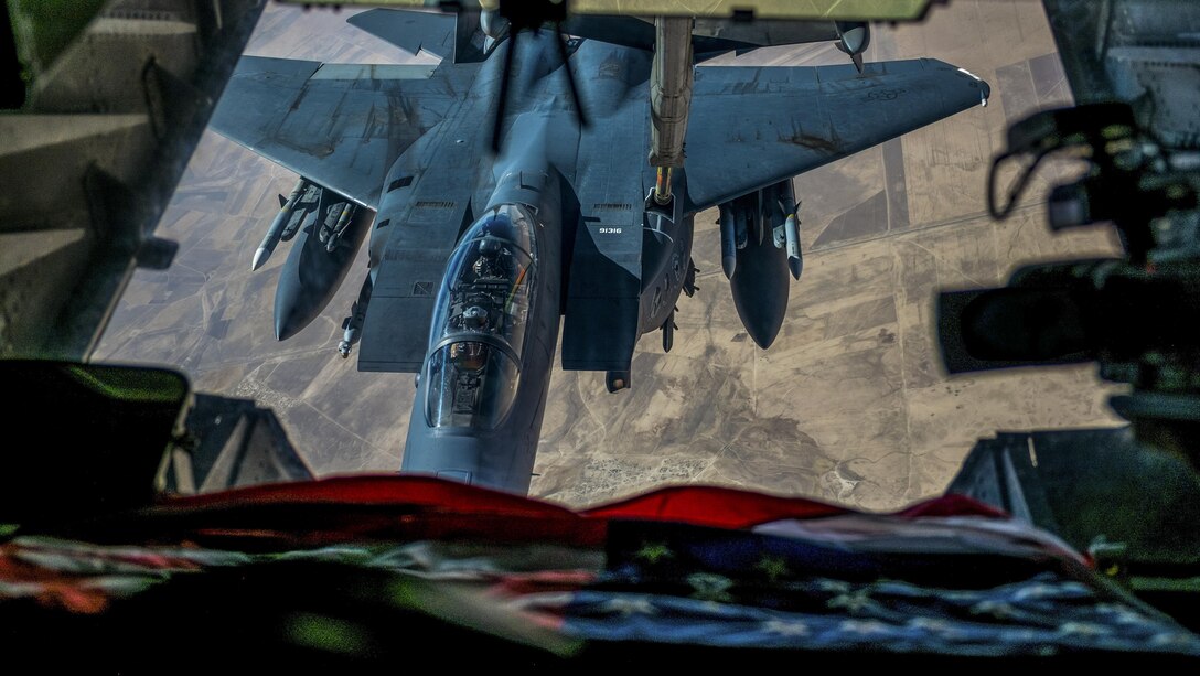 An F-15E Strike Eagle receives fuel from a KC-10 Extender over an undisclosed location in Southwest Asia, July 19, 2017. The F-15E is a dual-role fighter designed to perform air-to-air and air-to-ground missions. The KC-10 is assigned to the 908th Expeditionary Air Refueling Squadron. Air Force photo by Senior Airman Preston Webb