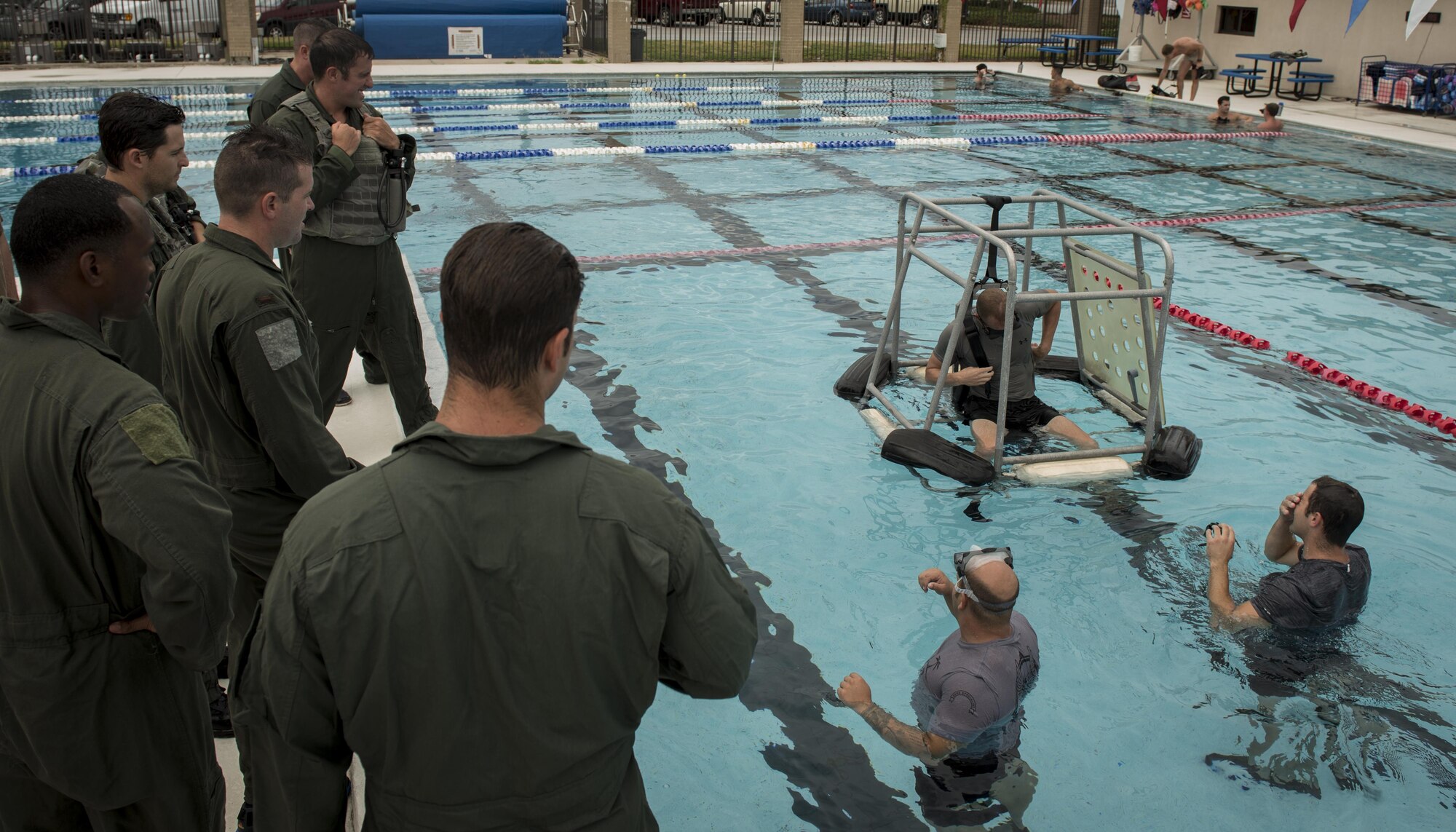 Survival, evasion, resistance and escape specialists with the 1st Special Operations Support Squadron conduct rotary wing water survival training with 8th Special Operations Squadron aircrew at Hurlburt Field, Fla., July 18, 2017. The 1st SOSS SERE specialists conduct rotary wing water survival training quarterly to ensure aircrew are proficient on emergency procedure skill sets. (U.S. Air Force photo by Airman 1st Class Joseph Pick)