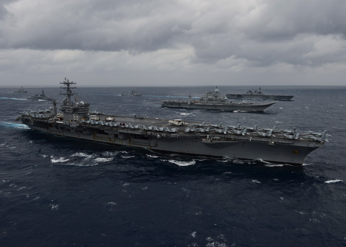 BAY OF BENGAL (July 17, 2017) Ships from the Indian Navy, Japan Maritime Self-Defense Force (JMSDF) and the U.S. Navy sail in formation, July 17, 2017, in the Bay of Bengal as part of Exercise Malabar 2017. Malabar 2017 is the latest in a continuing series of exercises between the Indian Navy, JMSDF and U.S. Navy that has grown in scope and complexity over the years to address the variety of shared threats to maritime security in the Indo-Asia-Pacific region. (U.S. Navy photo by Mass Communication Specialist 3rd Class Cole Schroeder)