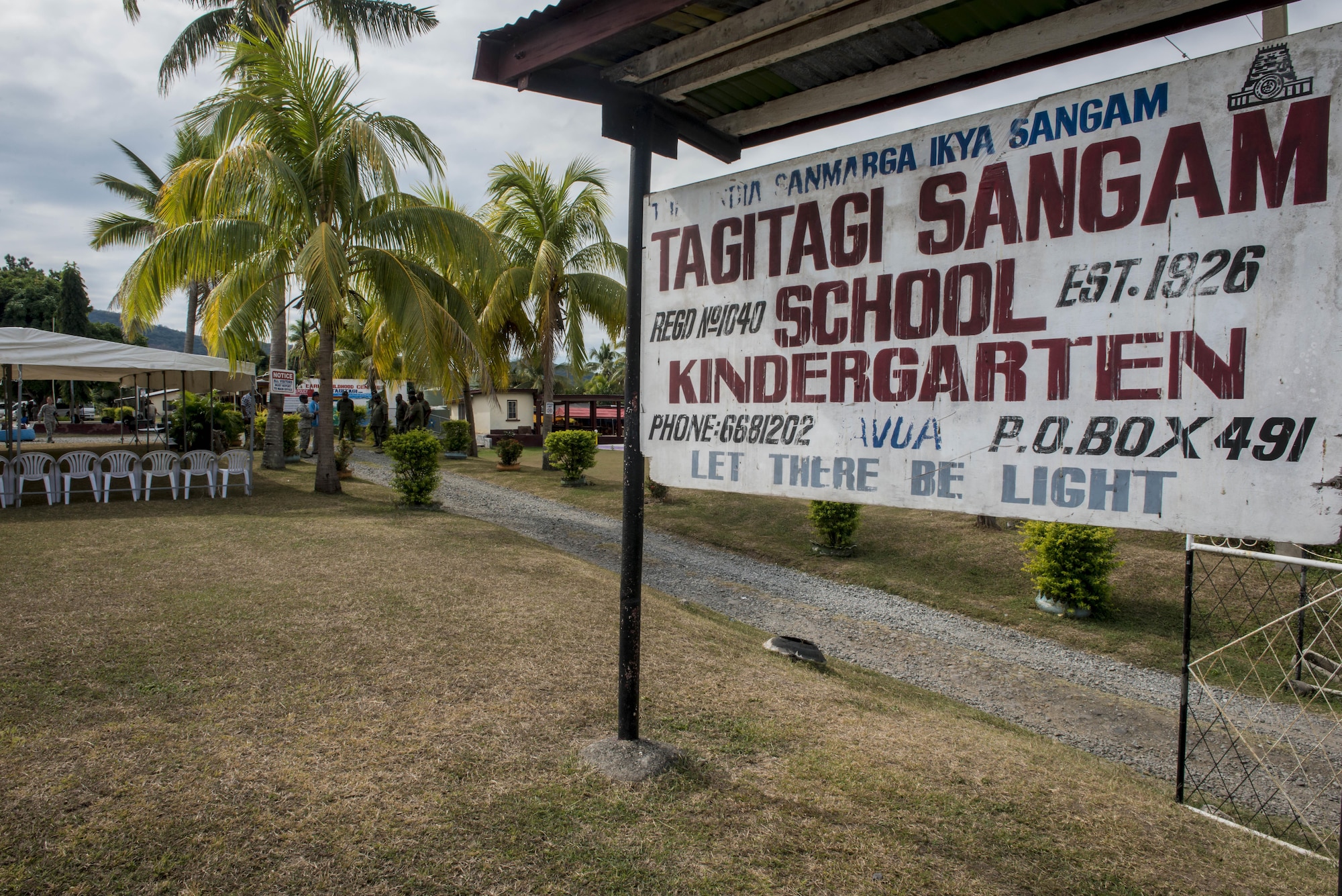 The Tagitagi Sangam School and Kindergarten’s sign stands at the gate to the school where Misawa Air Base, Japan, medics joined more than 50 U.S. service members for Pacific Angel 17-3 in Tavua, Fiji, July 15, 2017. Healthcare professionals representing nearly every unit at the 35th Medical Group flew to Fiji from Misawa July 10 with stops in Tokyo and Anderson Air Force Base, Guam. In Guam, they boarded an Air National Guard KC-135 Stratotanker from Fairchild Air Force Base, Washington, to make the final trek with the rest of the main body who flew from each of their respective bases for the final flight from Guam. (U.S. Air Force photo by Tech. Sgt. Benjamin W. Stratton)