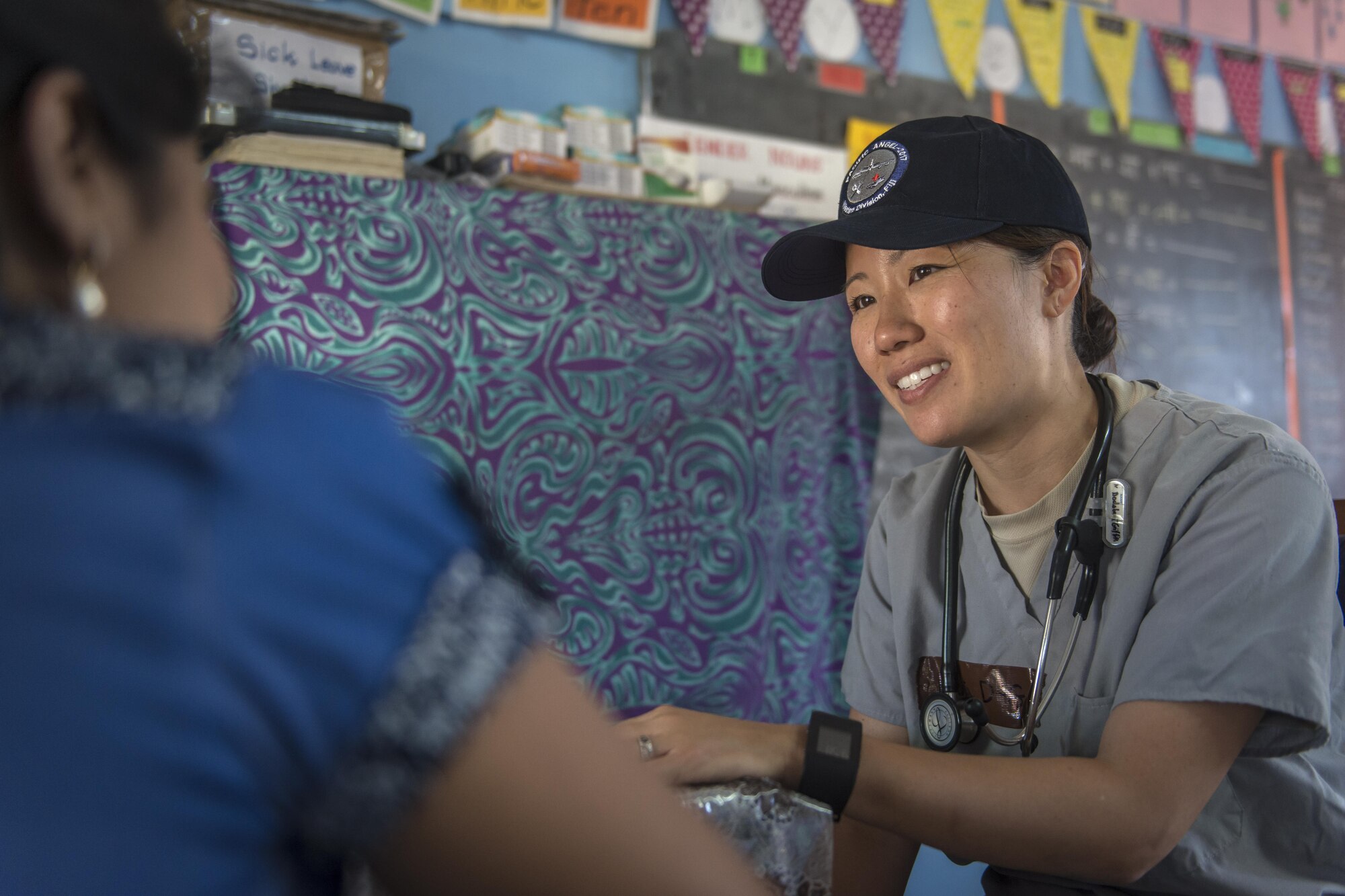 U.S. Air Force Maj. Lisa Dodobara-Griffith, a family physician and the primary care flight commander with the 35th Medical Operations Squadron at Misawa Air Base, Japan, talks with a Fijian patient about women’s health related issues during Pacific Angel 17-3 at Tagitagi Sangam School and Kindergarten in Tavua, Fiji, July 17, 2017. Dodobara-Griffith joined seven other Misawa Airmen for the exercise that strengthens the United States’ interoperability and relationships with multinational partners in the Indo-Asia-Pacific region. (U.S. Air Force photo by Tech. Sgt. Benjamin W. Stratton)