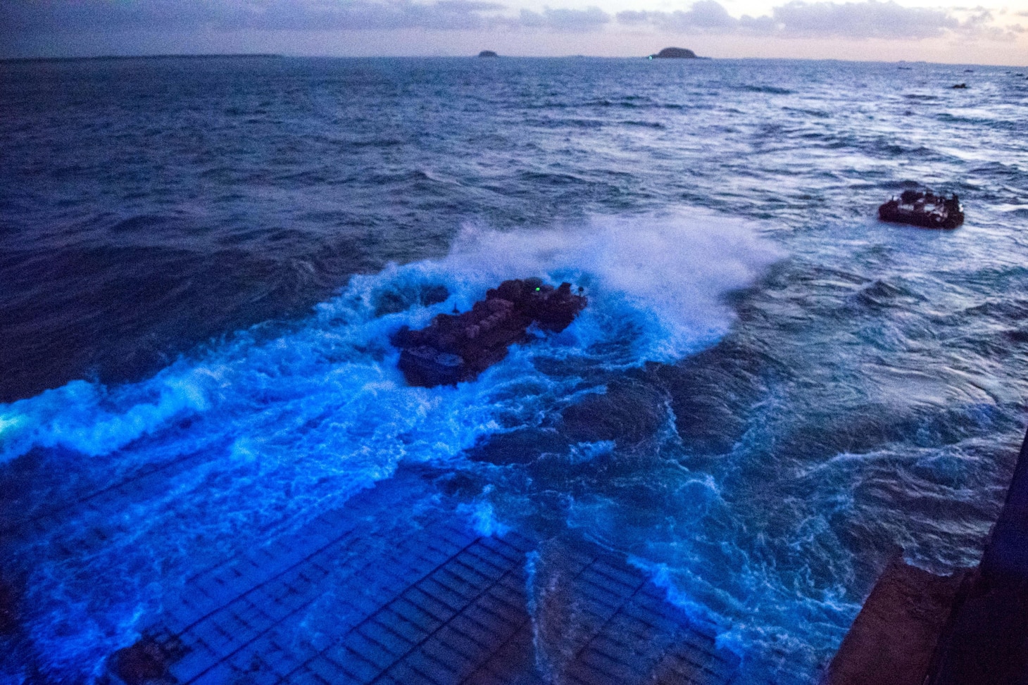 170712-N-UX013-171 SHOALWATER BAY, Australia (July 12, 2017) Amphibious assault vehicles, attached to the 31st Marine Expeditionary Unit, deploy from the well deck of the amphibious dock landing ship USS Ashland (LSD 48) for a beach raid training exercise during Talisman Saber 17. Ashland, part of a combined U.S.-Australia-New Zealand expeditionary strike group, is undergoing a series of scenarios that will increase naval proficiencies in operating against blue-water adversarial threats and in its primary mission of launching Marine forces ashore in the littorals. Talisman Saber is a biennial U.S.-Australia bilateral exercise held off the coast of Australia meant to achieve interoperability and strengthen the U.S.-Australia alliance. (U.S. Navy photo by Mass Communication Specialist 3rd Class Jonathan Clay/Released)