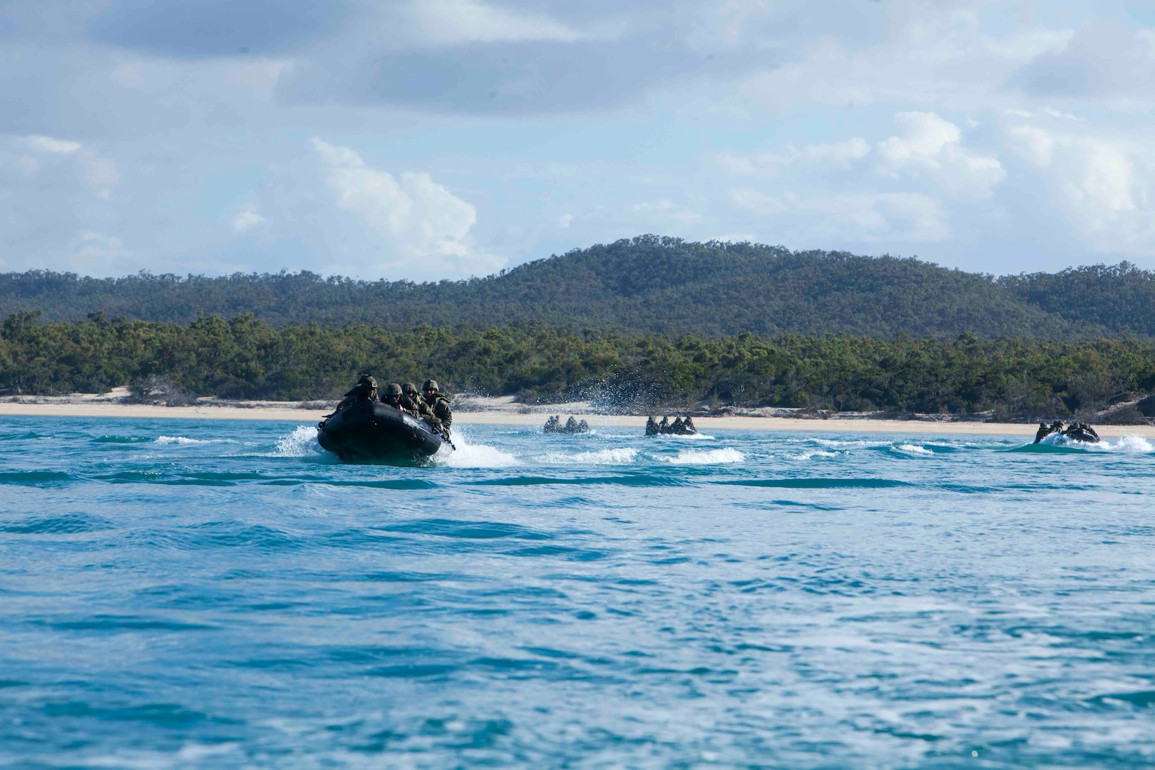 Marines with Lima Company, Battalion Landing Team, 3rd Battalion, 5th Marines, 31st Marine Expeditionary Unit, navigate Combat Rubber Raiding Craft off the coast of Australia during an amphibious landing as part of Talisman Saber 17, July 15th, 2017. Talisman Saber is a biennial exercise designed to improve the interoperability between Australian and U.S. forces. The 31st MEU is taking part in Talisman Saber 17 while deployed on its regularly-scheduled patrol of the Indo-Asia-Pacific region. (U.S. Marine Corps photo by Lance Cpl. Jonah Baase/Released)