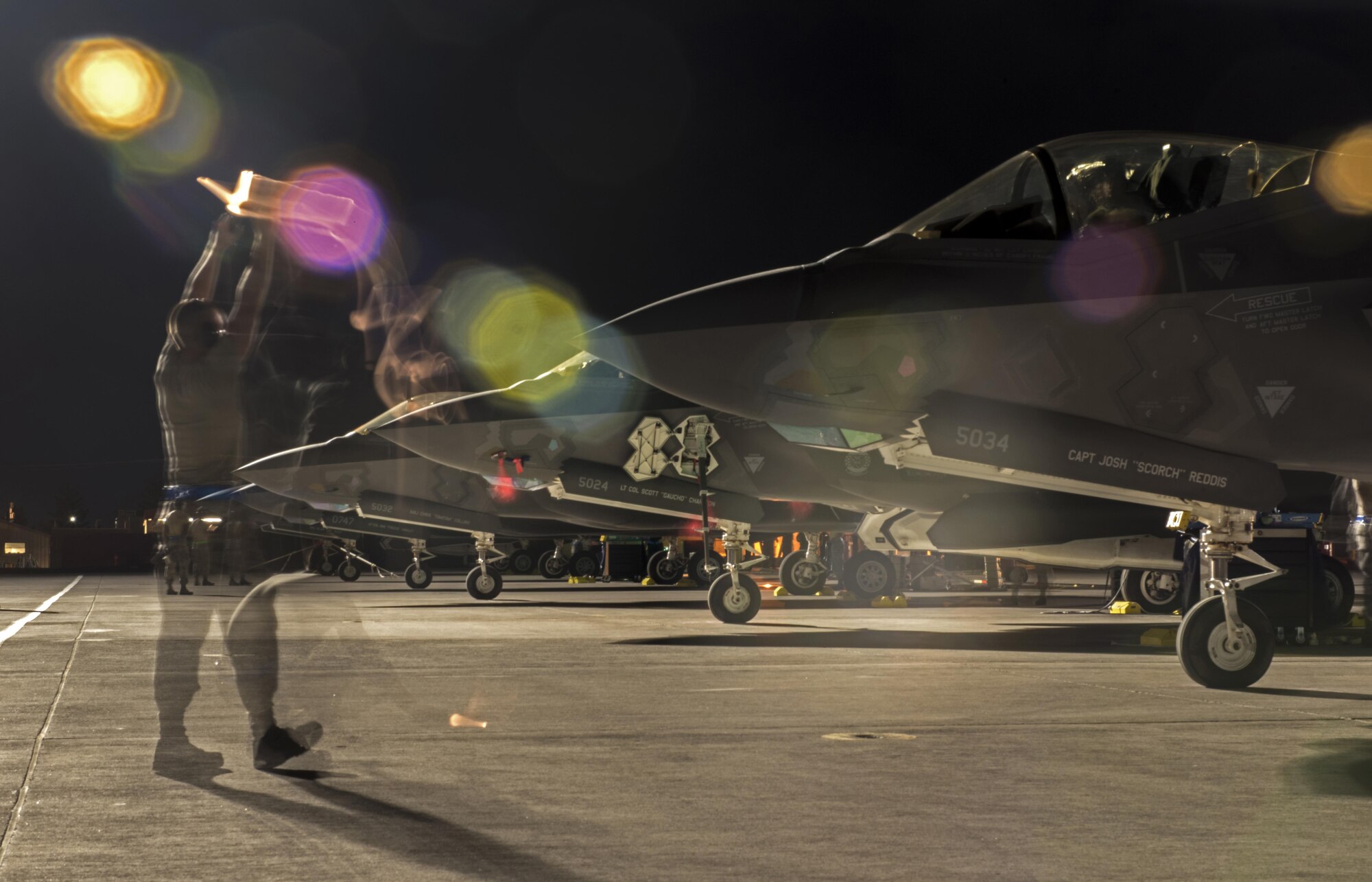 U.S. Air Force Airman 1st Class Travis Jackson, 33rd Aircraft Maintenance Squadron assistant dedicated crew chief, marshals an F-35A Lightning II July 18, 2017, at Nellis Air Force Base, Nev. The 33rd Fighter Wing and Marine Attack Squadron 221 from Yuma, Ariz., participated in the first combat exercise with Air Force F-35As and Marine Corps F-35Bs operating simultaneously during Red Flag 17-3. The large scale exercise, which was developed to provide pilots with critical experience in combat situations, enabled F-35 pilots to plan and train using the same tactics, techniques and procedures. (U.S. Air Force photo by Staff Sgt. Peter Thompson)