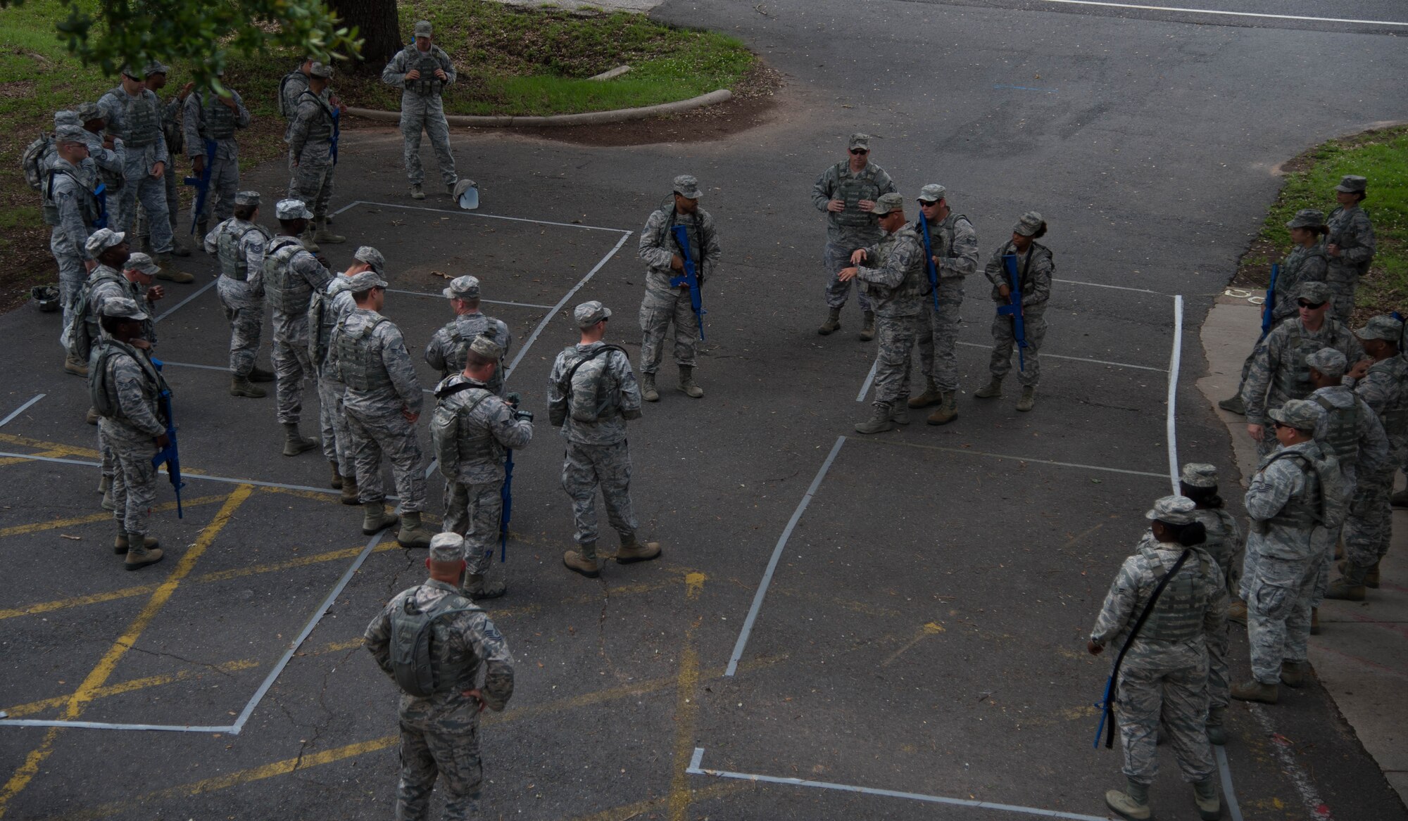 Defenders with the 307th Security Forces Squadron use simulated weapons while running through various scenarios before transitioning to real weapons during an active shooter training session at Barksdale Air Force Base, La., May 30, 2017. The two-day annual training helps prepare the defenders to react during real-world situations. (U.S. Air Force photo by Staff Sgt. Jason McCasland)