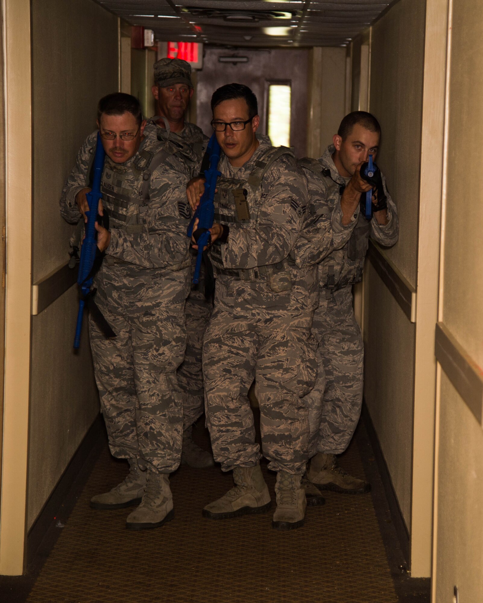 Defenders with the 307th Security Forces Squadron use simulated weapons while running through various scenarios before transitioning to real weapons during an active shooter exercise at Barksdale Air Force Base, La., May 30, 2017. The two-day annual training helps prepare the defenders to react during real-world situations. (U.S. Air Force photo by Staff Sgt. Jason McCasland)