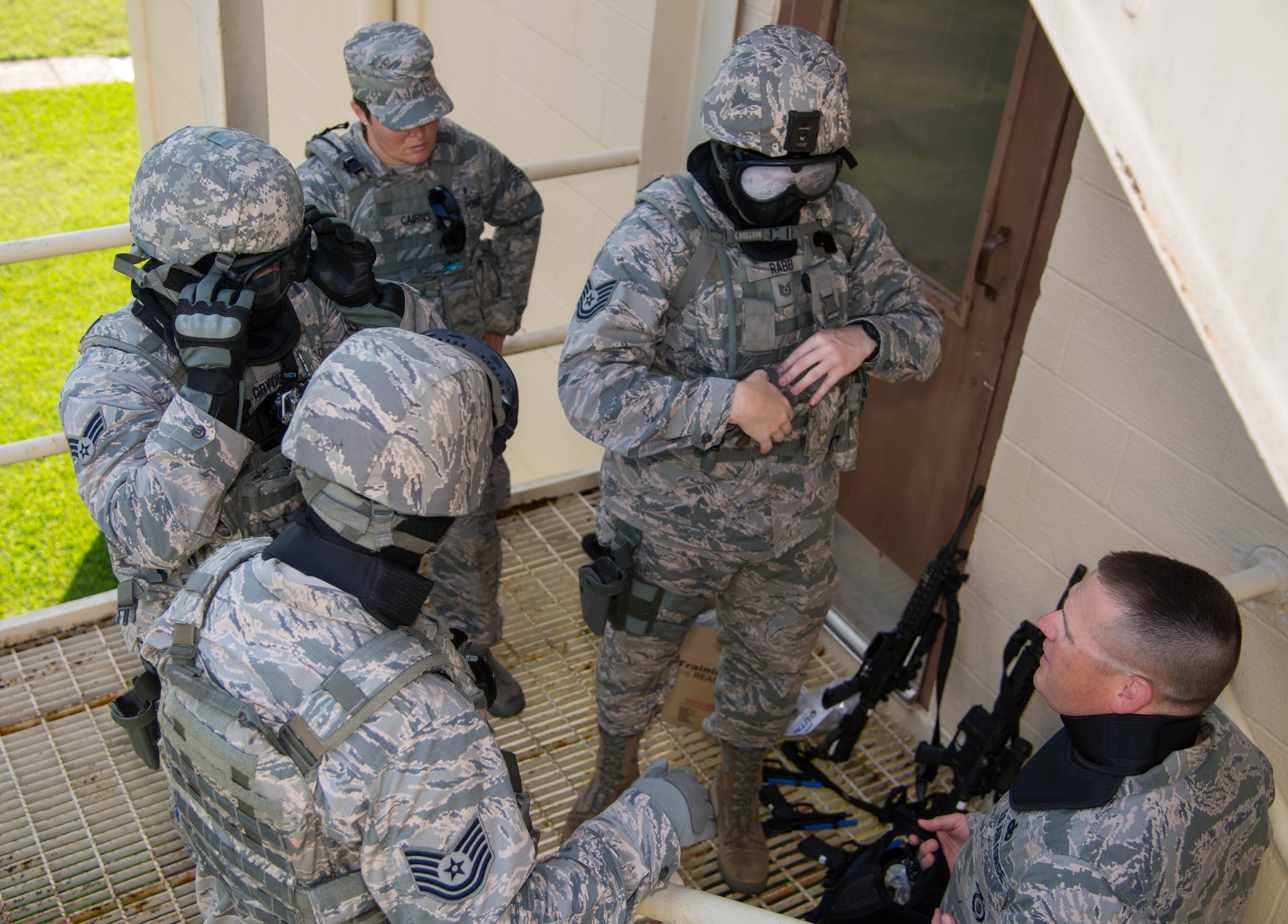 Defenders with the 307th Security Forces Squadron receive a safety briefing before entering the building at Barksdale Air Force Base, La., May 31, 2017. The defenders performed close quarters fire team search techniques during the exercise. The training scenario consisted of an active shooter threat and tested defender’s reaction times. (U.S. Air Force photo by Staff Sgt. Jason McCasland)