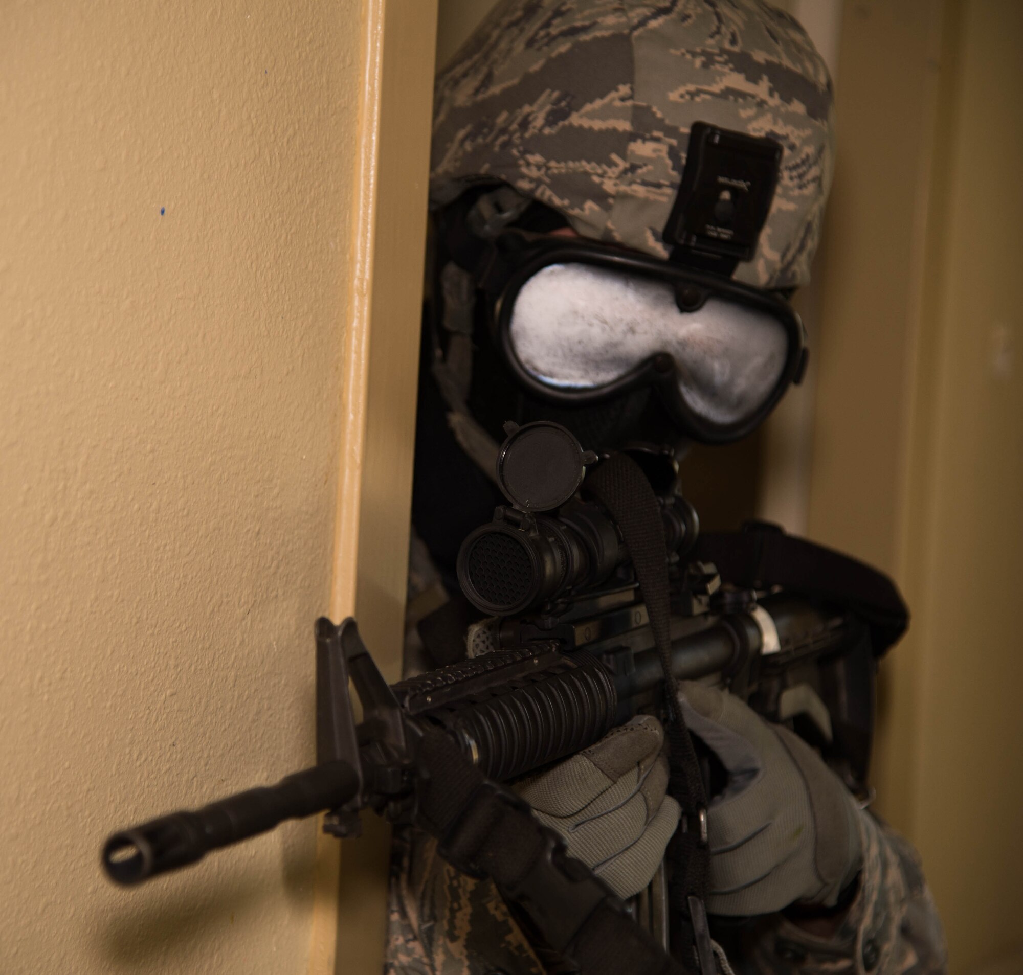 A defender with the 307th Security Forces Squadron secures the hallway during an active shooter exercise at Barksdale Air Force Base, La., May 31, 2017. The two-day annual exercise provided defenders with a simulated environment used to prepare for real-world situations. (U.S. Air Force photo by Staff Sgt. Jason McCasland)