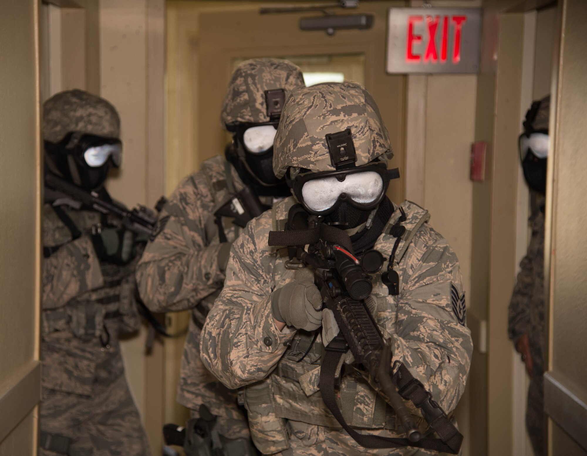 Defenders with the 307th Security Forces Squadron use an M-4 carbine while running through various scenarios during an active shooter exercise at Barksdale Air Force Base, La., May 31, 2017. The M-4 carbine is a variant of the M-16A2 assault rifle which uses a 5.56×45mm NATO round. During the training simulated paint rounds were used to provide defenders crucial live-fire training without the using lethal ammunition. (U.S. Air Force photo by Staff Sgt. Jason McCasland)