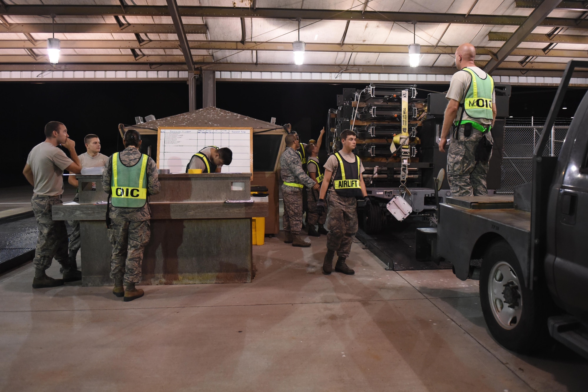 Members of the 4th Fighter Wing prepare cargo equipment for a simulated transport during exercise Thunderdome 17-02, July 20, 2017, at Seymour Johnson Air Force Base, North Carolina. By working together during the exercise, members of the 4th Fighter Wing continue to enhance cargo transportation capabilities. (U.S. Air Force photo by Airman 1st Class Victoria Boyton)