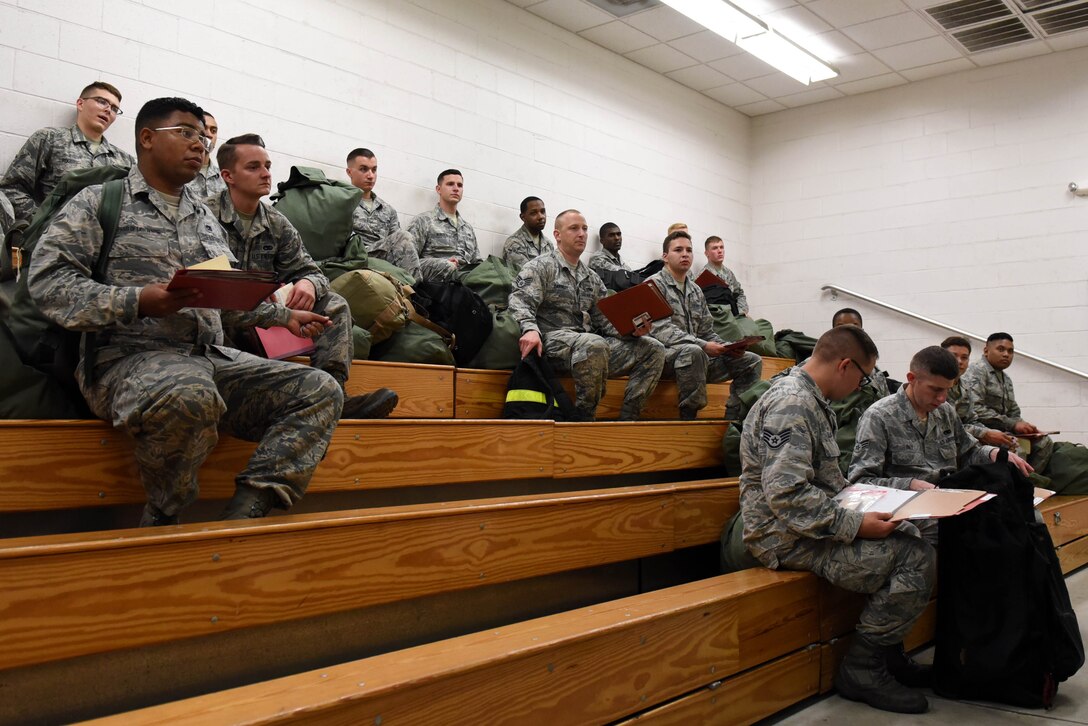 Participants of exercise Thunderdome 17-02 receive a simulated deployment briefing, July 20, 2017, at Seymour Johnson Air Force Base, North Carolina. The exercise allowed members of the 4th Fighter Wing to strengthen skills for real-world operations. (U.S. Air Force photo by Airman 1st Class Victoria Boyton)