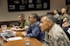 U.S. Air Force Chief Master Sgt. Terrence Greene, United States Forces, Japan and 5th Air Force command chief, Japan Maritime Self-Defense Force Warrant Officer Toshiaki Miyamae, Joint Staff senior enlisted adviser to the chief of staff, and U.S. Marine Corps Sgt. Maj. Anthony Spadaro, U.S. Pacific Command senior enlisted leader, listen to opening remarks during the bilateral Senior Enlisted Leader (SEL) Symposium at Yokota Air Base, Japan, July 13, 2017. The symposium was a two-day event in which SELs between U.S. and Japan discuss various enlisted leadership development programs. (U.S. Air Force photo by Yasuo Osakabe)
