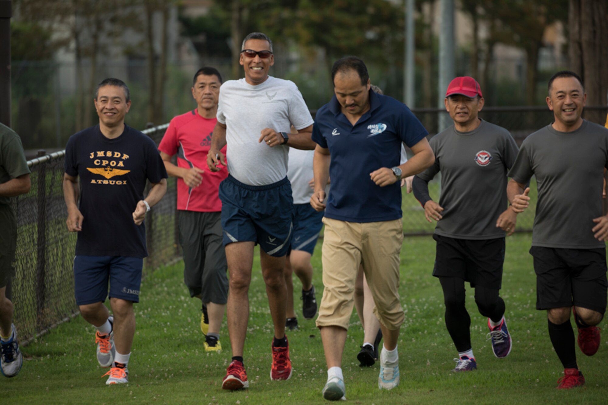 Senior Enlisted Leaders from the United States Forces, Japan and Japan Self-Defense Forces jog during the bilateral SEL Symposium physical training (PT) session at Yokota Air Base, Japan, July 14, 2017. USFJ component and JSDF senior enlisted leaders met to strengthen the U.S. and Japan partnership by discussing shared leadership principles including ways each service makes improvements. (U.S. Air Force photo by Yasuo Osakabe)
