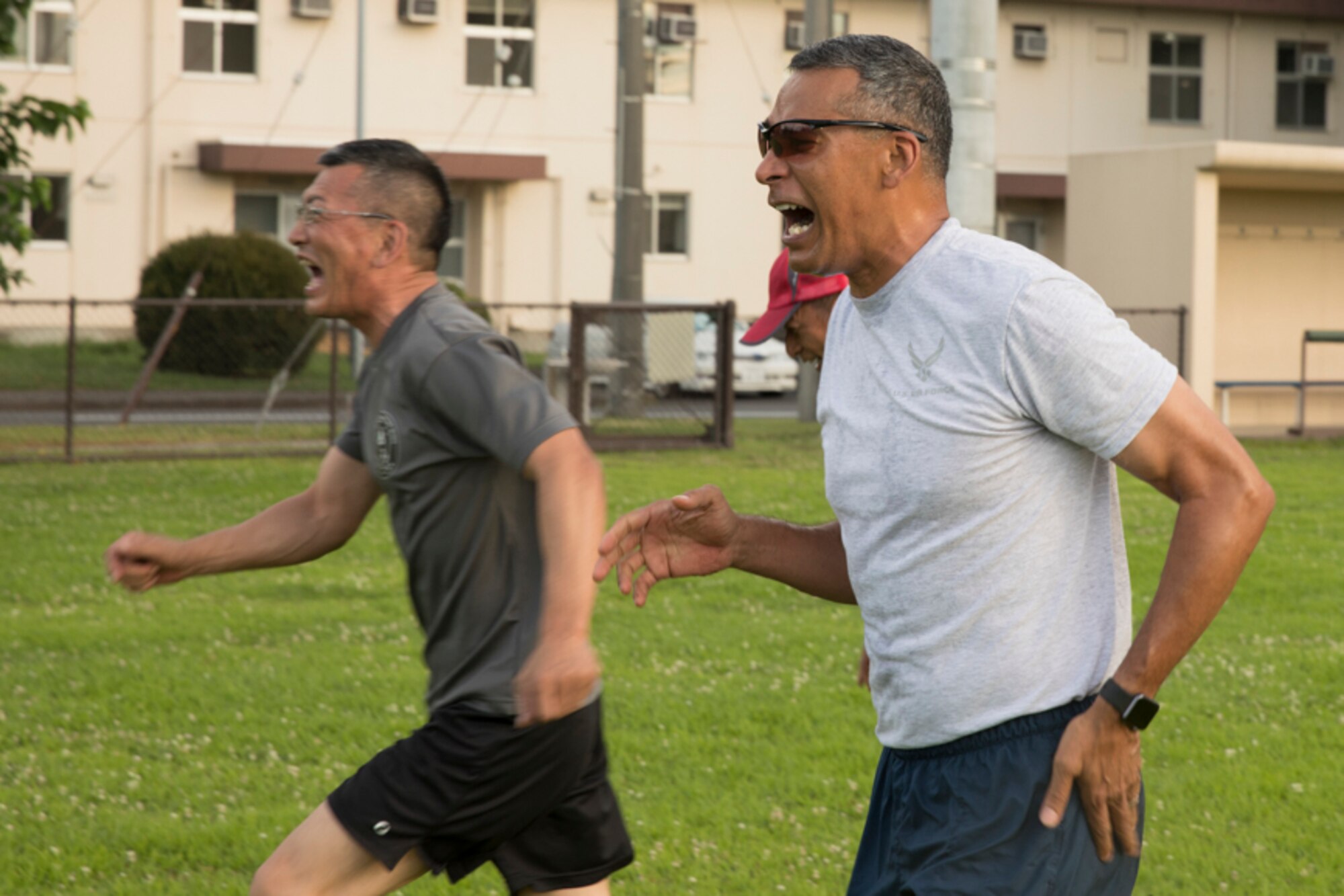 U.S. Air Force Chief Master Sgt. Terrence Greene, Unites States Forces, Japan and 5th Air Force command chief, and Japan Air Self- Defense Force Warrant Officer Katsumi Yamazaki, the senior enlisted advisor of the JASDF yell at each other to get motivation during the USFJ and JSDF Senior Enlisted Leader Symposium physical training session at Yokota Air Base, Japan, July 14, 2017. “Be ready to fight or fight tonight; it’s not about just skills, also mental and physical agility. If the formation is not pushing themselves and staying healthy, when it comes to contingency, whether its a humanitarian assistance and disaster relief (HA/DR) or real combat, they are not going to be able to face any stress,” said Greene. (U.S. Air Force photo by Yasuo Osakabe)