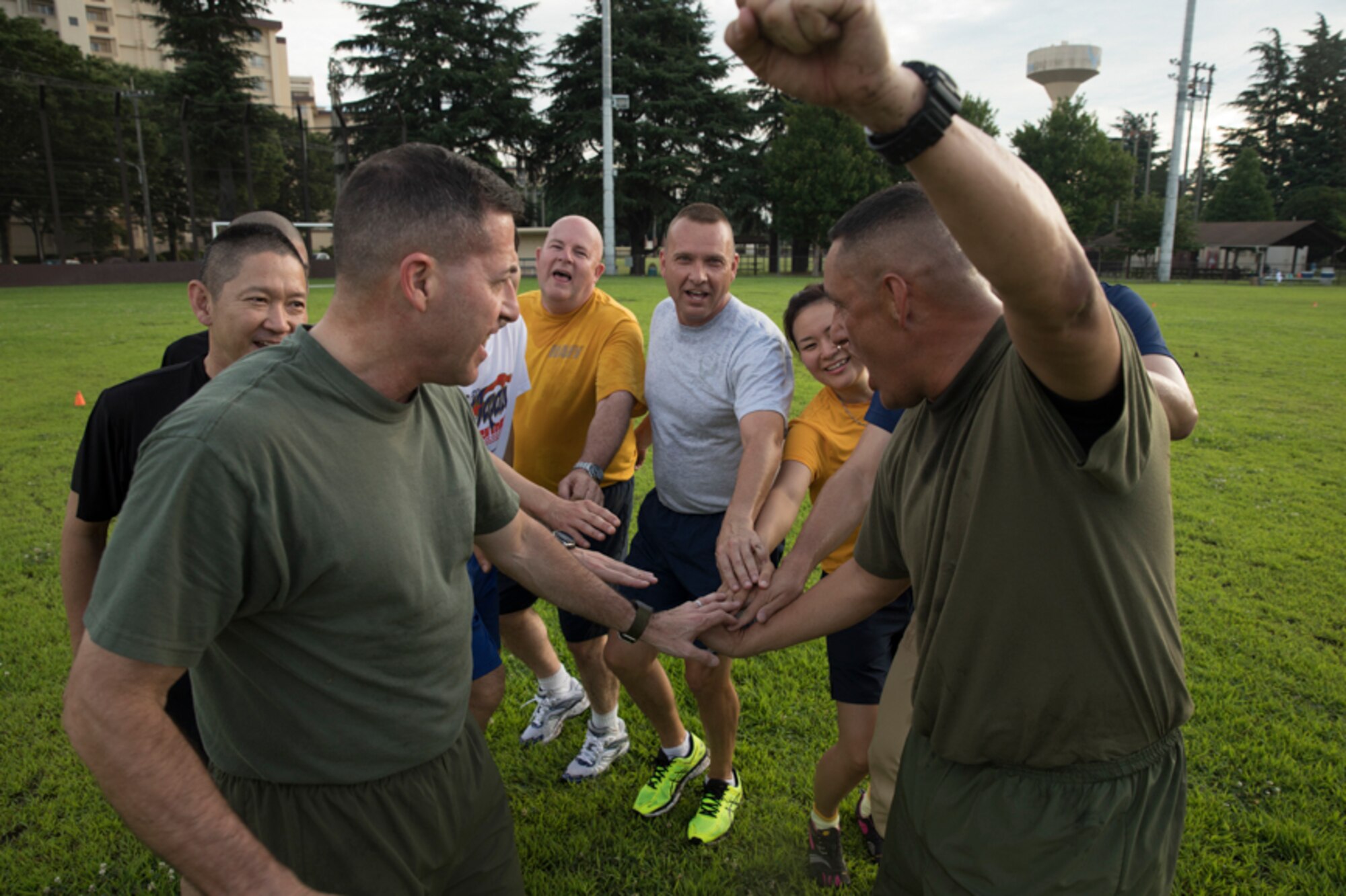 Senior Enlisted Leaders from the United States Forces, Japan component and Japan Self-Defense Forces encourage each other during the USFJ and JSDF Senior Enlisted Leader (SEL) Symposium physical training session at Yokota Air Base, Japan, July 14, 2017. “Be ready to fight or fight tonight; it’s not about just skills, also mental and physical agility. If the formation is not pushing themselves and staying healthy, when it comes to contingency, whether its a humanitarian assistance and disaster relief (HA/DR) or real combat, they are not going to be able to face any stress,” said U.S. Air Force Chief Master Sgt. Terrence Greene, USFJ and 5th Air Force command chief. (U.S. Air Force photo by Yasuo Osakabe)